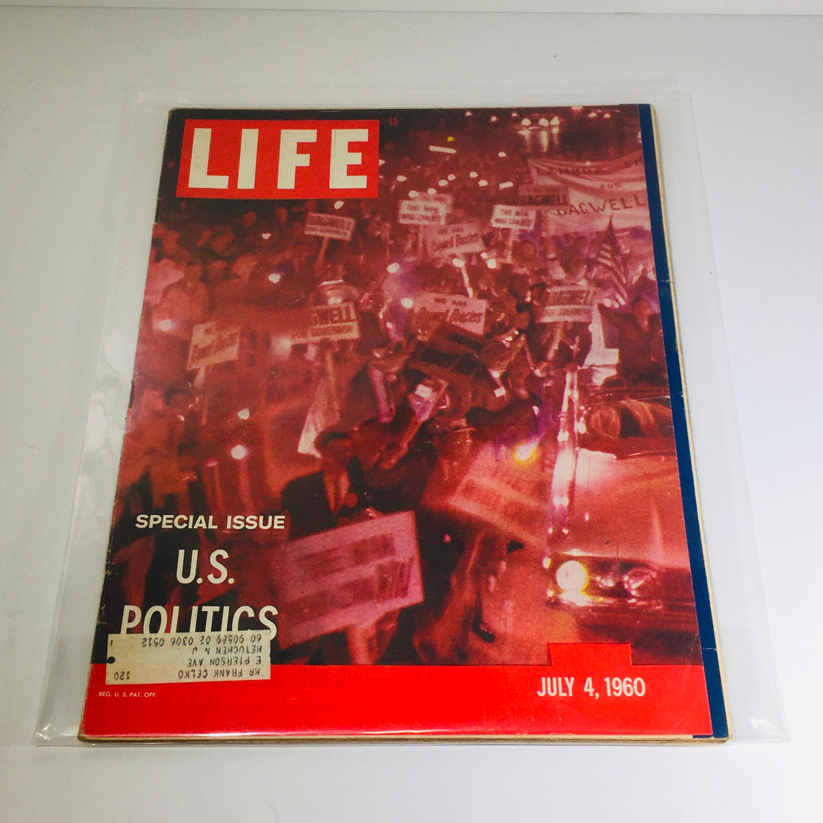 Cover of vintage Life Magazine, July 4, 1960, special issue on U.S. politics, showcasing a crowd with protest signs, illustrating the political climate of the era.