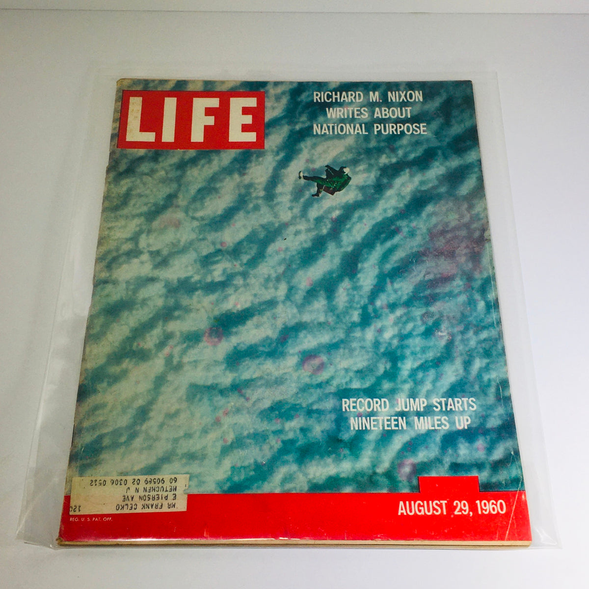 Vintage Life Magazine cover from August 29, 1960, featuring the record jump story and Richard Nixon's writings, presenting a colorful sky with an airplane and bold title.