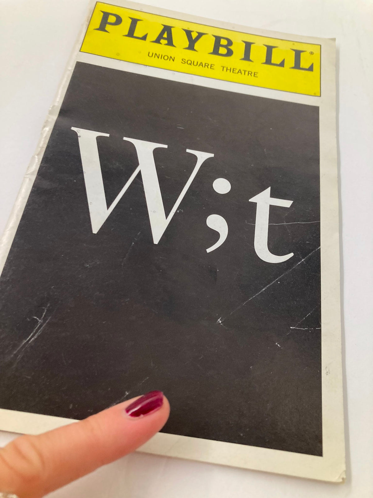 Close-up view of the 2000 Playbill for 'Wit' at Union Square Theatre, highlighting its vintage design and condition.