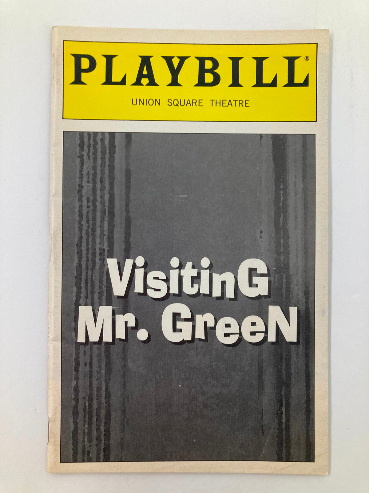 1998 Playbill for Visiting Mr. Green, featuring the title prominently displayed in bold typography against a grey background, showcasing the Union Square Theatre production.