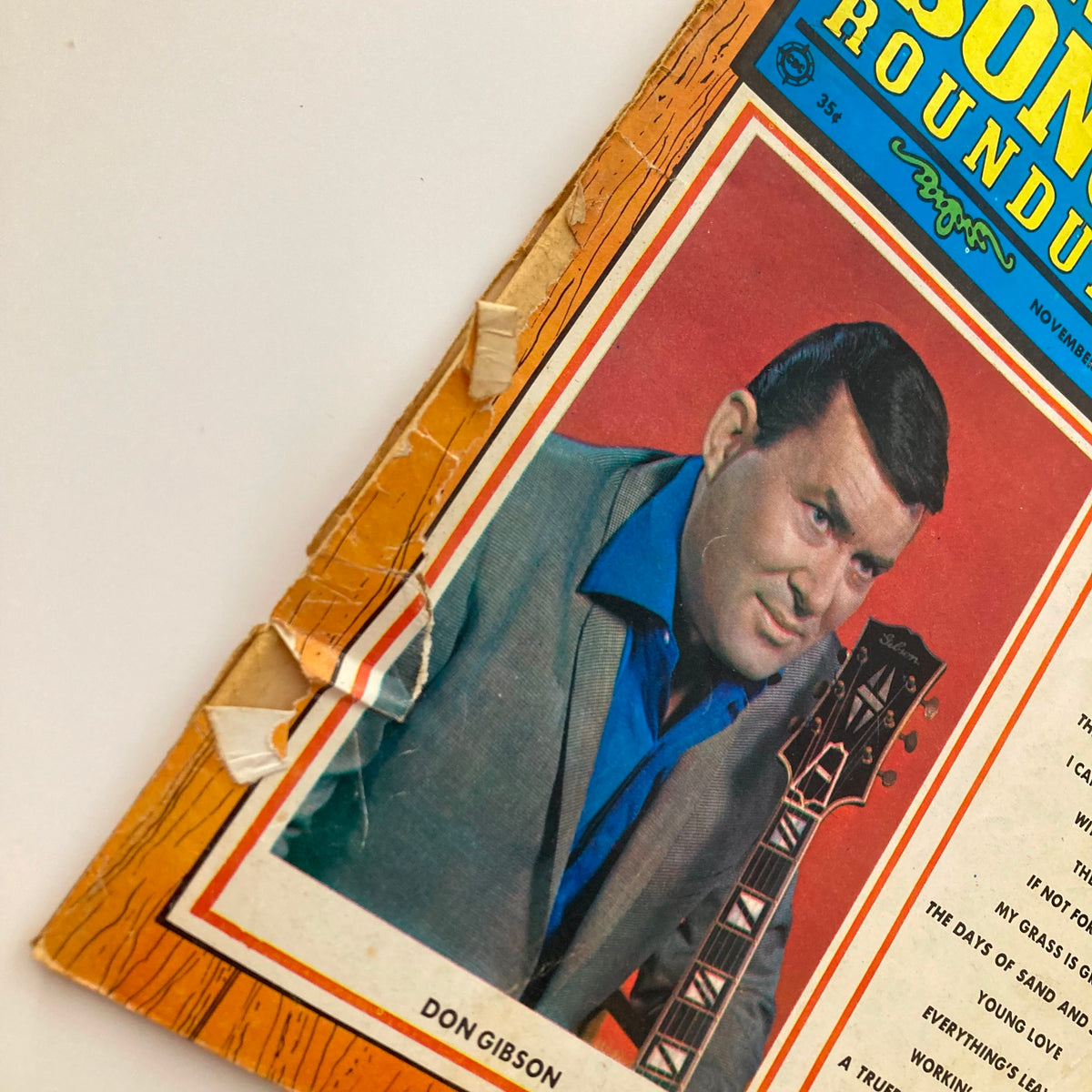 Close-up of VTG Country Song Roundup Magazine November 1969 cover showing Don Gibson with guitar and magazine title.