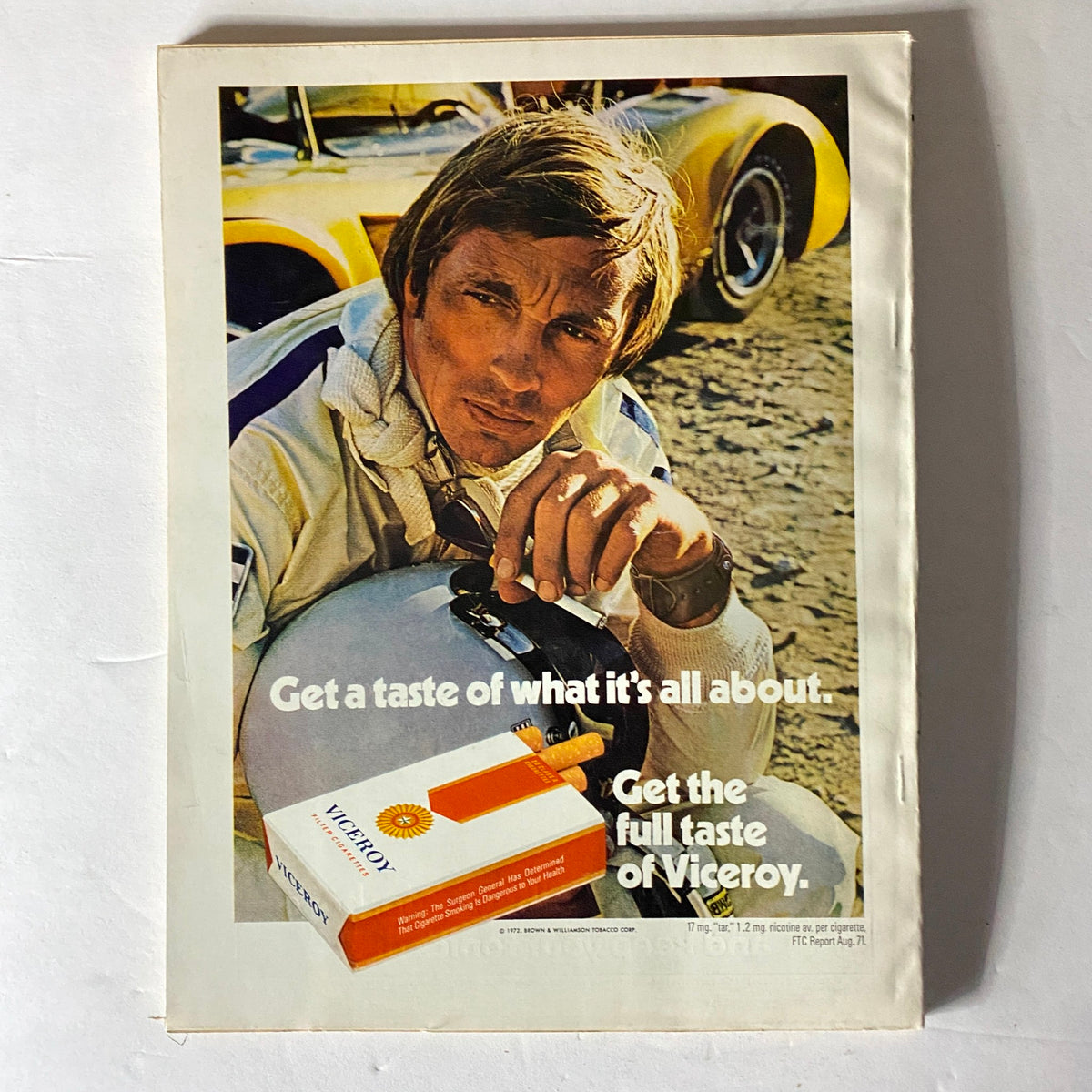 Viceroy cigarette advertisement featuring a man in racing gear, emphasizing the slogan 'Get a taste of what it's all about', from Esquire Magazine August 1972 with Walt Frazier cover.