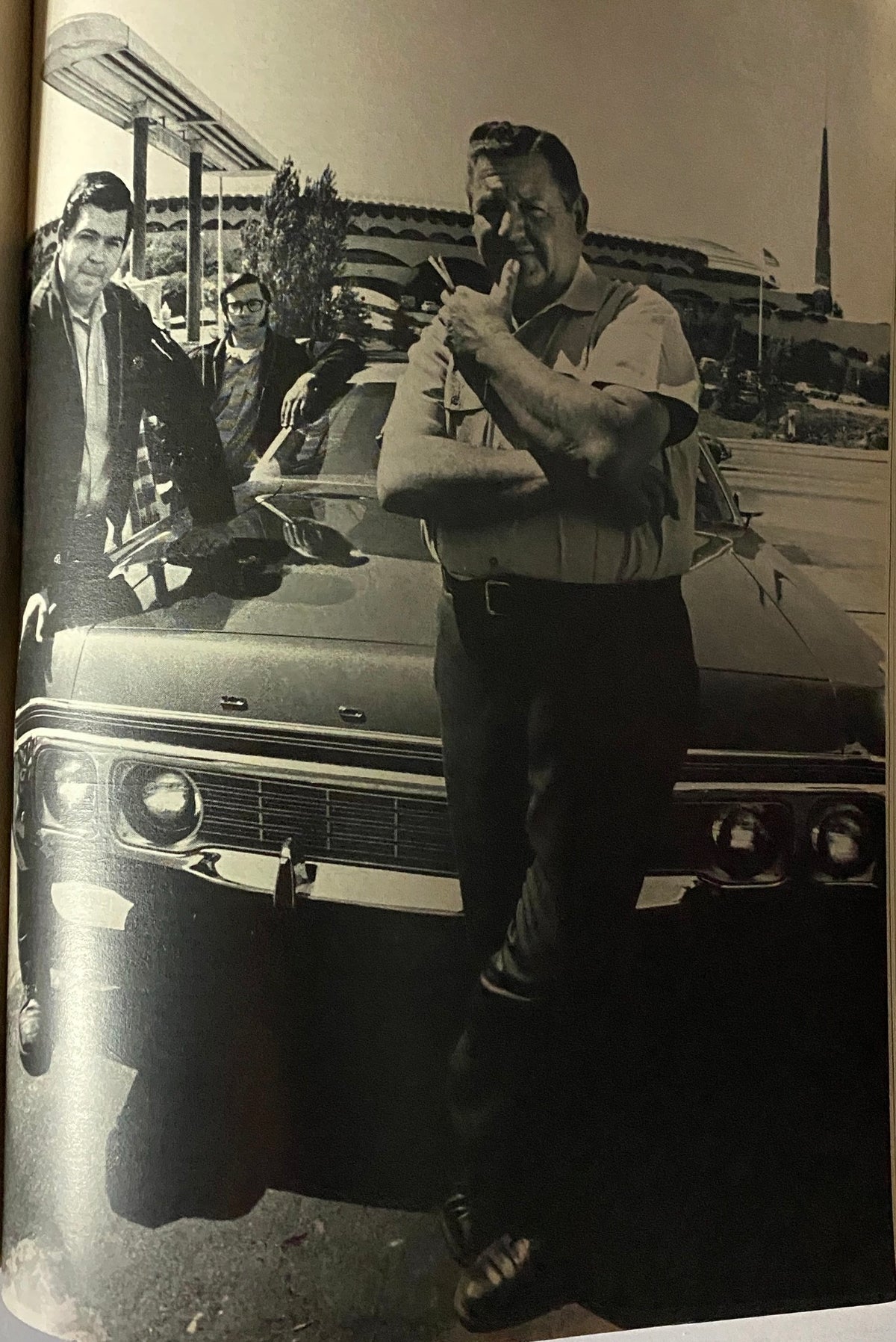 Vintage black and white photograph from Esquire Magazine July 1972, depicting three individuals beside a classic car, showcasing the era's style.