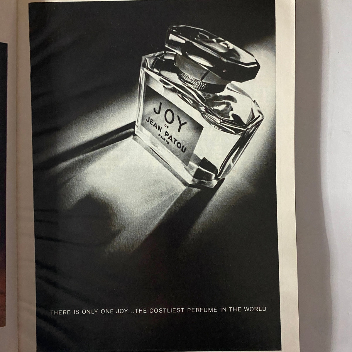Esquire Magazine May 1974 featuring an advertisement for Joy perfume by Jean Patou, showcasing the elegant bottle with the tagline about it being the costliest perfume in the world.