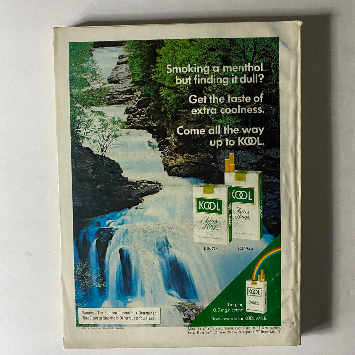 Back cover of Esquire Magazine October 1974 Super Sports Special featuring an advertisement for KOOL menthol cigarettes, showcasing a serene waterfall and text promoting the fresh taste of the product.