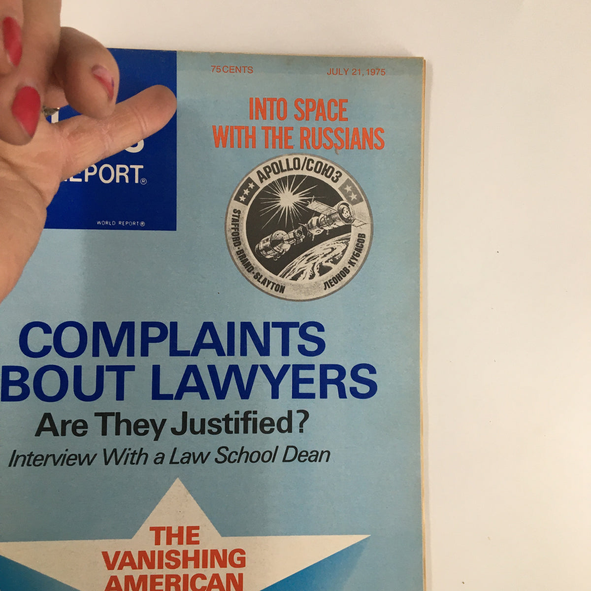 Cover detail of US News & World Report Magazine July 21 1975, highlighting the feature article 'Complaints About Lawyers' and the Apollo/Soyuz badge, with a hand partially visible in the corner.