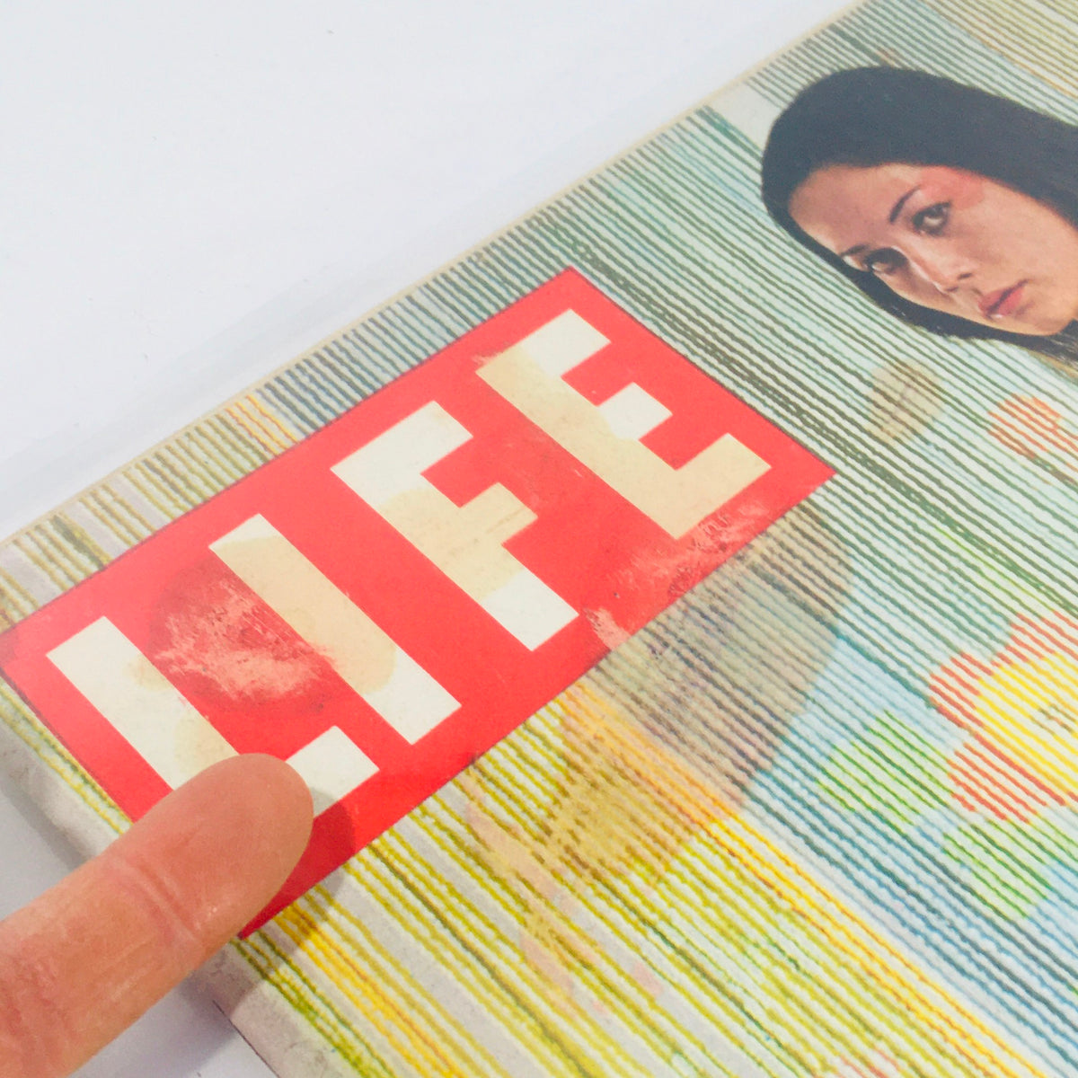 Close-up of the Life Magazine cover with Nancy Kwan as Suzie Wong, highlighting the magazine title and artistic details from October 24, 1960.