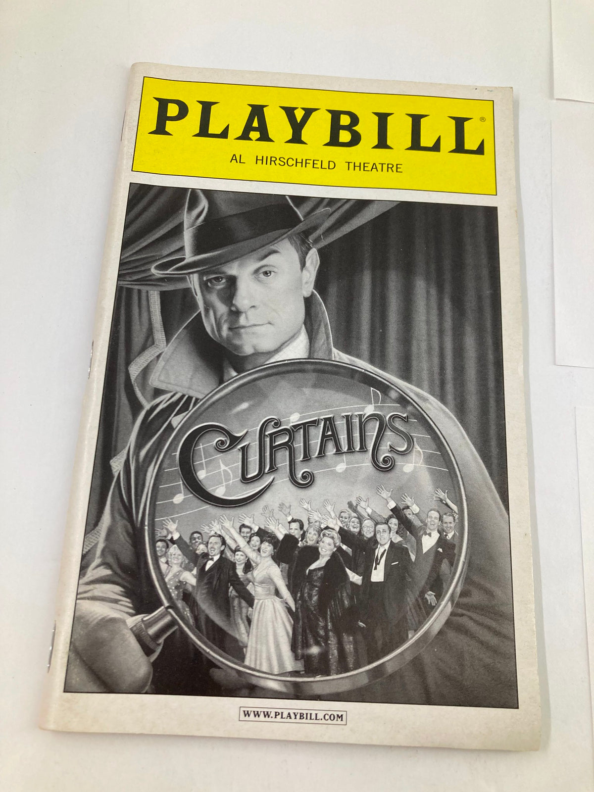 2008 Playbill Al Hirschfeld Theatre cover, showcasing the title 'Curtains' and a stylish image of a character in a detective-like pose.