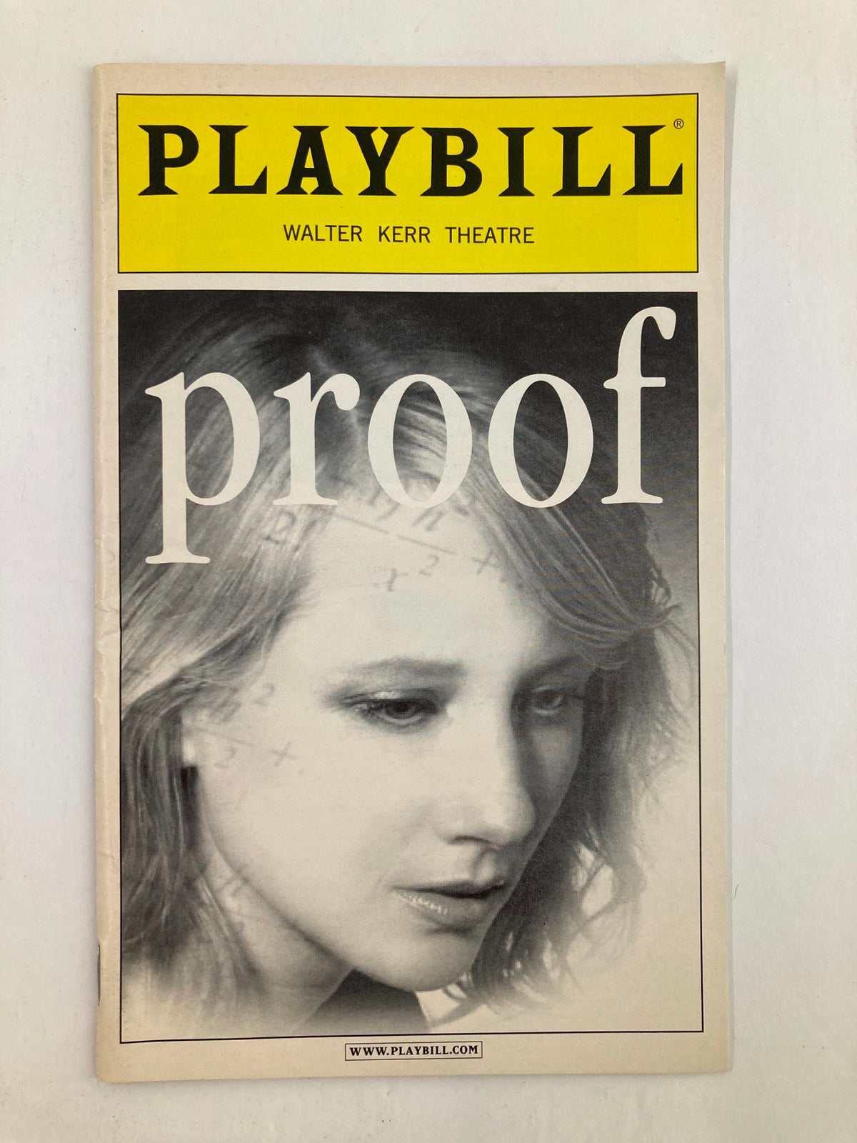 2002 Playbill for the Walter Kerr Theatre featuring the play Proof, showcasing a close-up of a woman's thoughtful expression, capturing the essence of the performance with Anne Heche and Len Cariou.