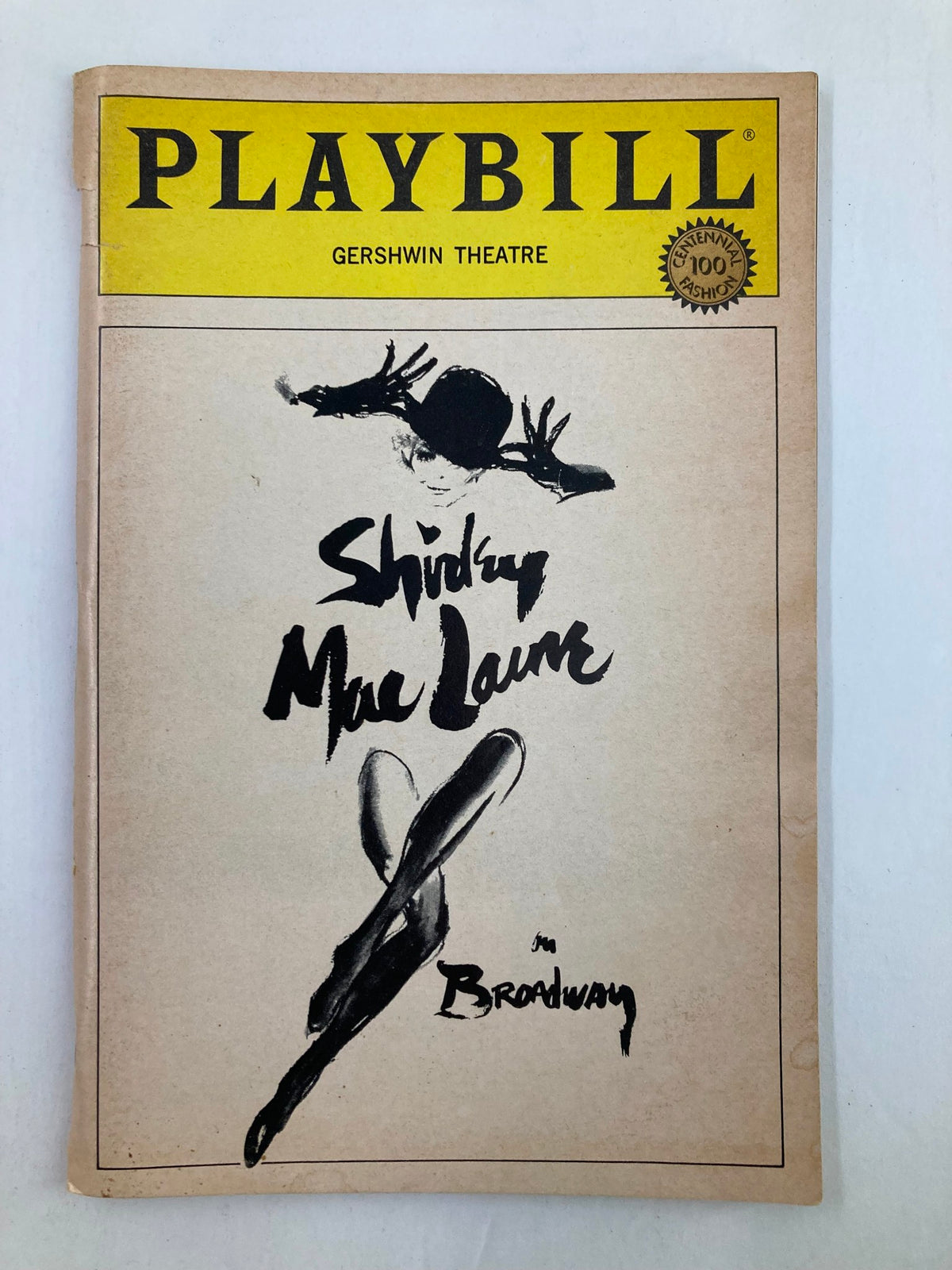 1984 Playbill for Broadway featuring Shirley MacLaine at the Gershwin Theatre, designed by Alan Johnson. The cover showcases a unique artistic design celebrating the classic performance.