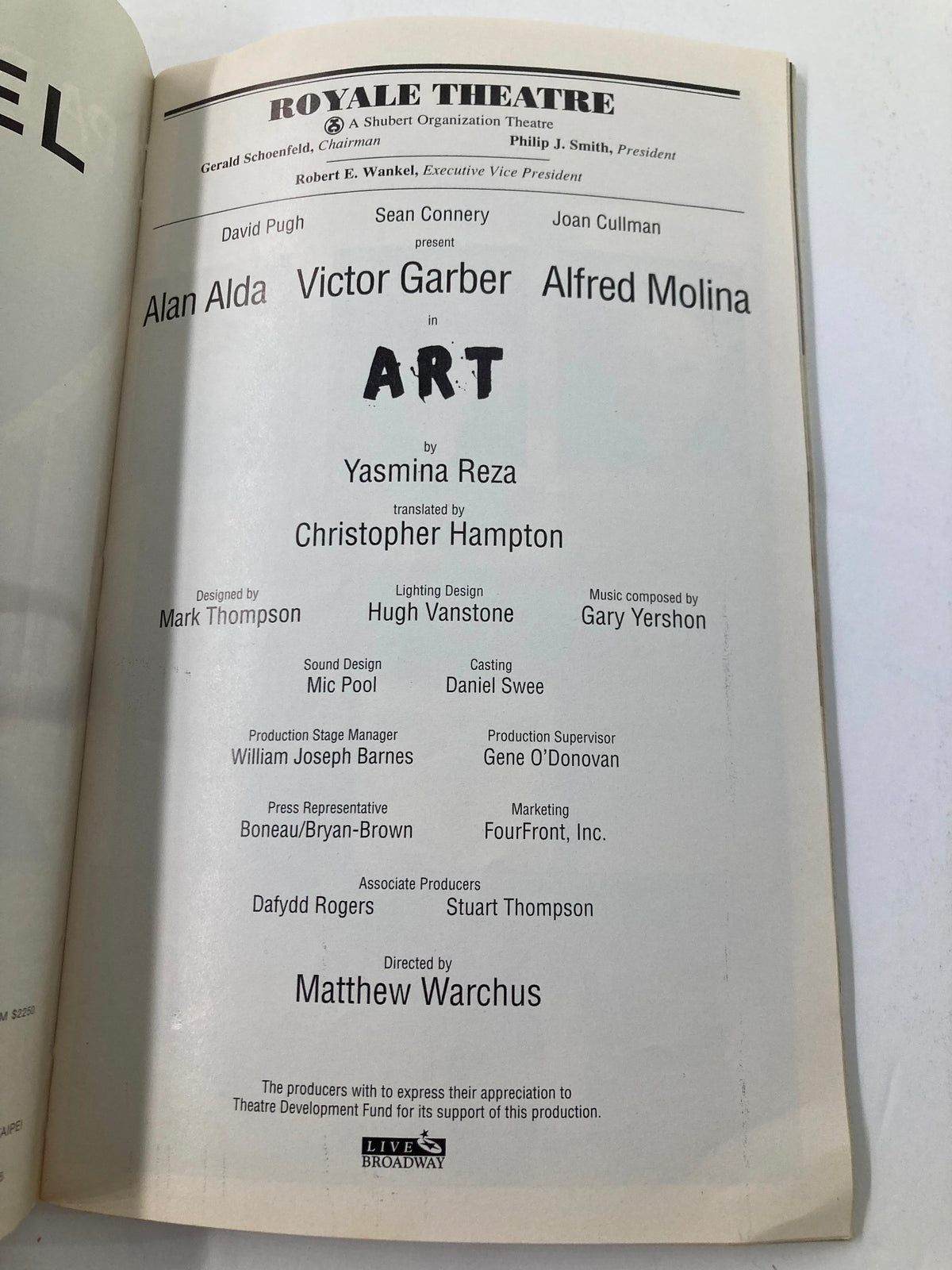 Interior view of the 1998 Playbill from the Royale Theatre featuring the play 'Art' by Yasmina Reza, starring Alan Alda and Victor Garber. The image showcases the production details and creative team, making it a valuable piece of theater memorabilia.
