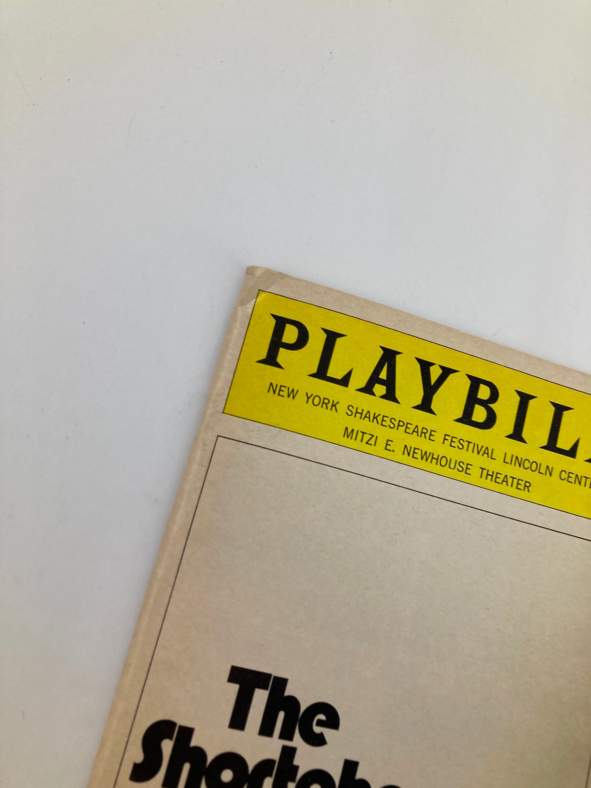 Close-up of the top section of the 1976 Playbill for The Shortchanged Review, showcasing the title and theater details for the New York Shakespeare Festival.