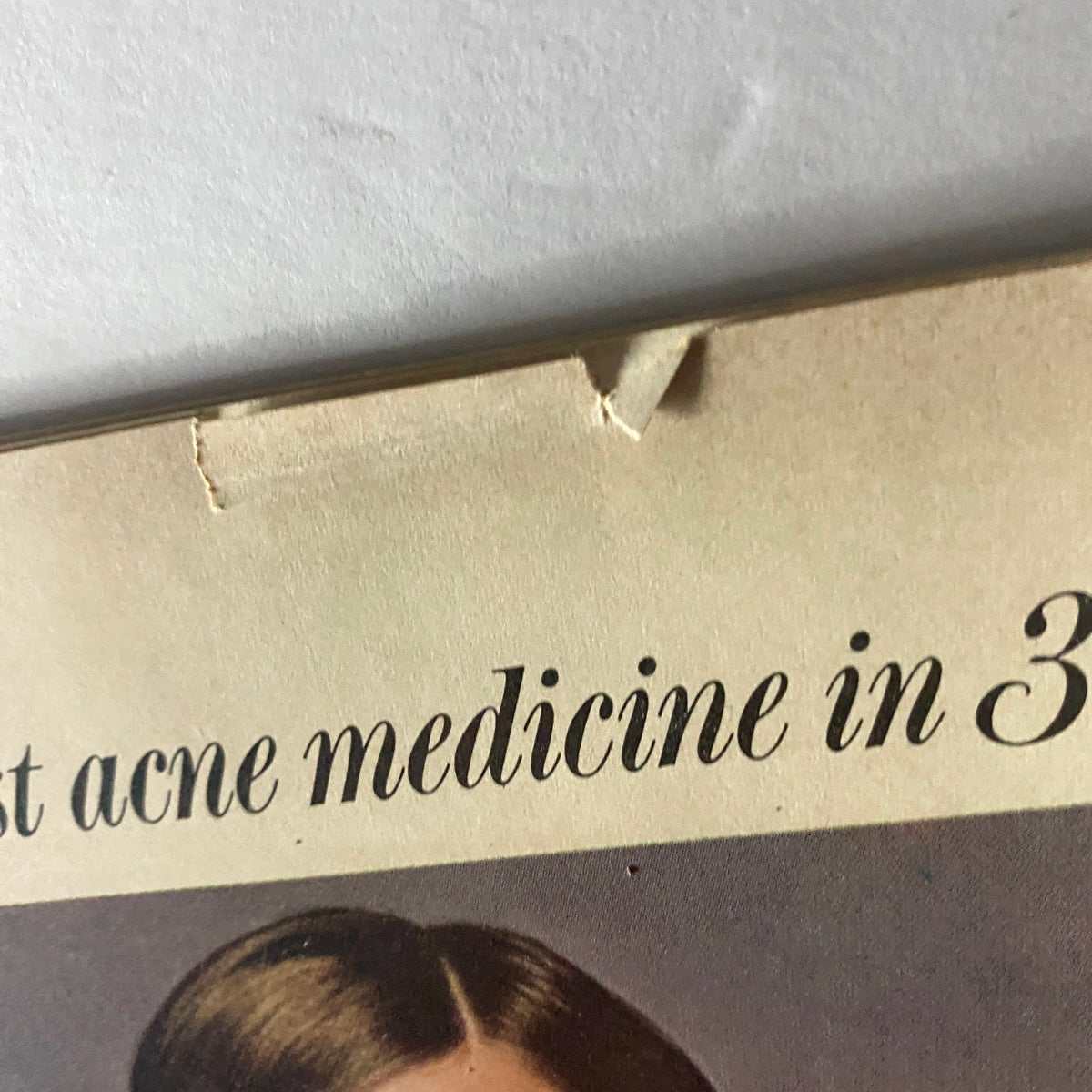 Close-up of the back cover of American Girl Magazine December 1968 focusing on the tagline for the Cover Girl Plus 3 acne medicine advertisement.