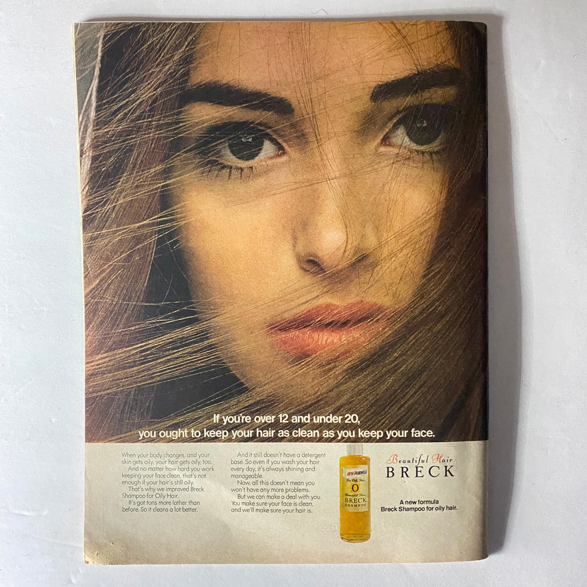 Full-page advertisement for Breck Shampoo in Teen Magazine March 1969, featuring a model with long hair emphasizing hair care for young individuals.