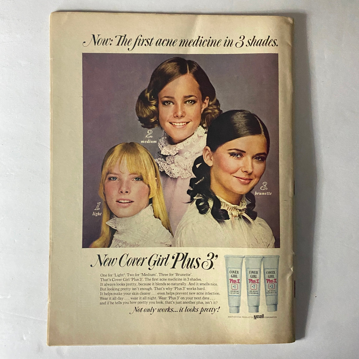 Vintage advertisement from American Girl Magazine February 1969 promoting Cover Girl Plus, featuring models showcasing beauty products in three shades.
