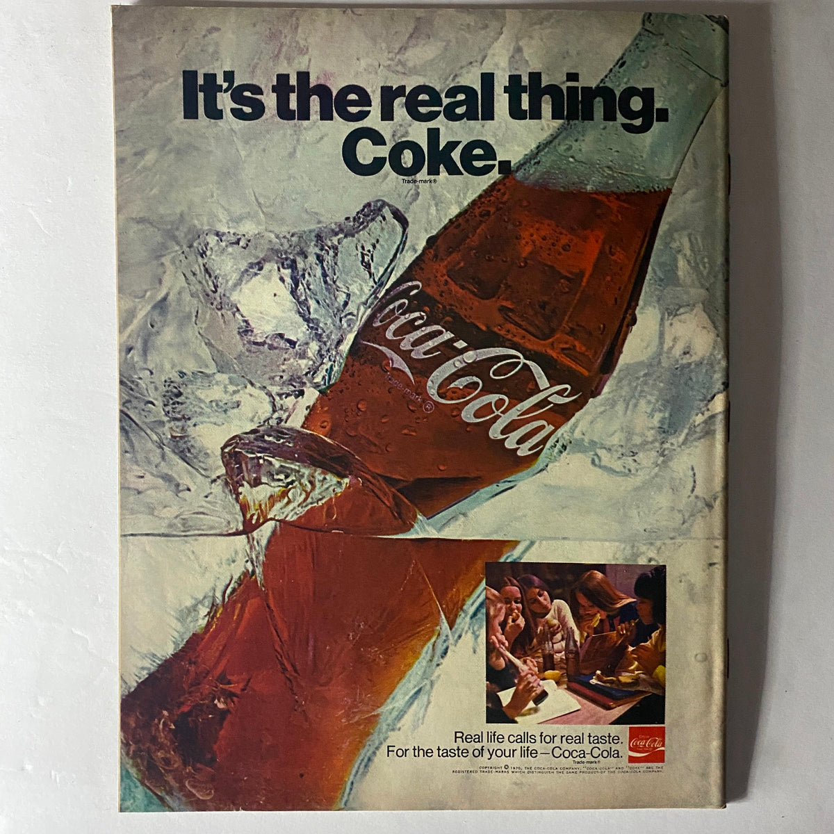 American Girl Magazine May 1970 cover featuring the tagline 'It's the real thing. Coke.' with an image of a Coca-Cola bottle surrounded by ice.