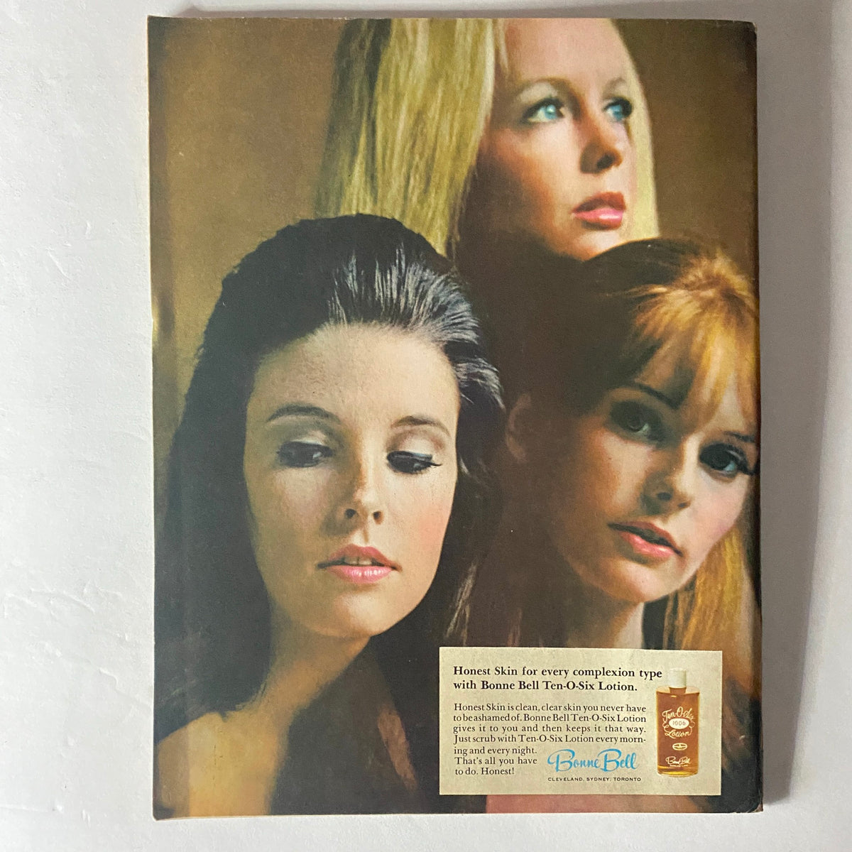 Cover of the American Girl Magazine from August 1969, featuring three women with varied hairstyles, showcasing beauty trends of the era alongside an advertisement for Bonne Bell Ten-O-Six Lotion.