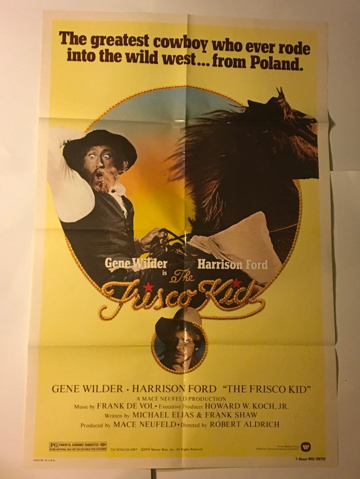 1979 The Frisco Kid 41" x 27" Original Movie Poster featuring Gene Wilder and Harrison Ford. The image captures the poster with the title and main artists, set against a backdrop of Western imagery.