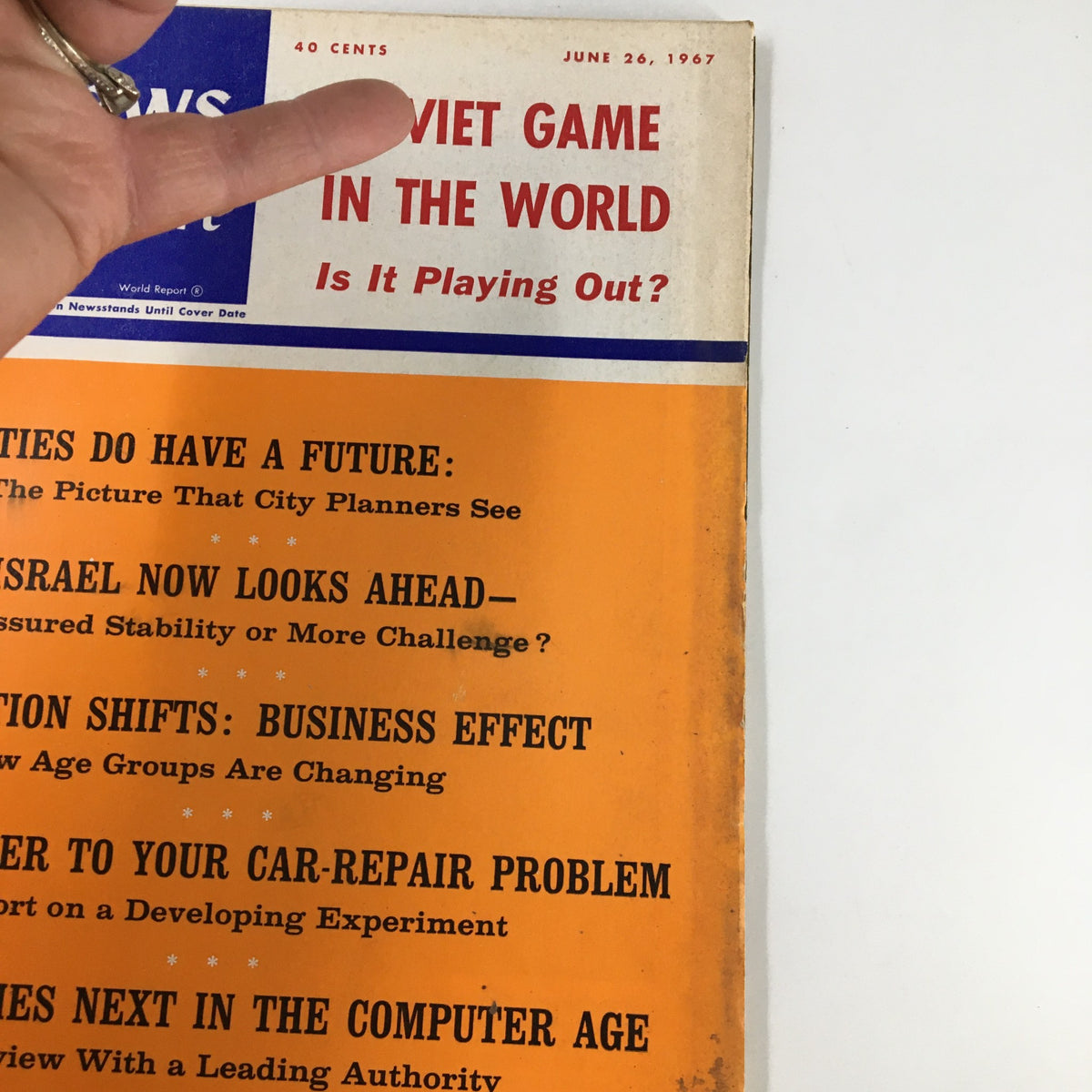 Close-up of the cover of US News & World Report Magazine June 26, 1967 highlighting 'Soviet Game in The World', including articles on city planners, Israel, business effects, and issues in the computer age.