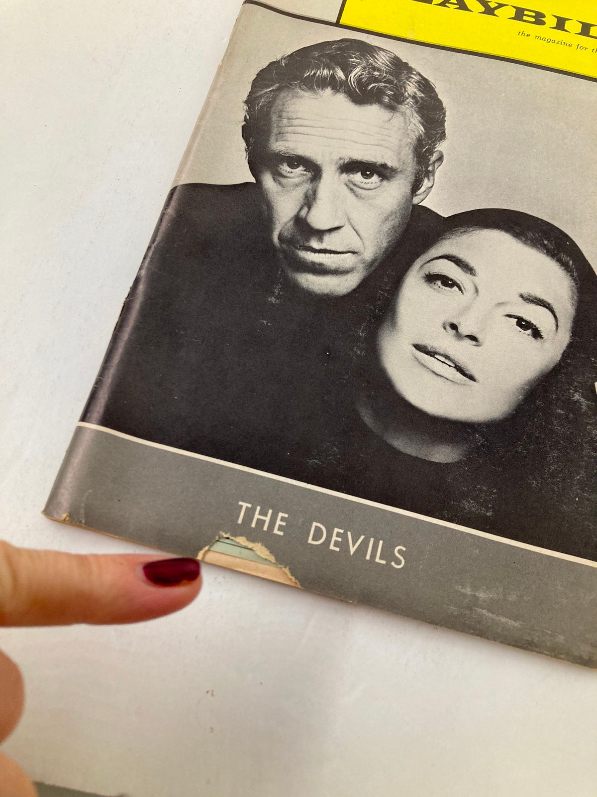 Close-up image of the 1965 Playbill for The Devils highlighting a minor tear at the bottom, featuring Jason Robards and Anne Bancroft.