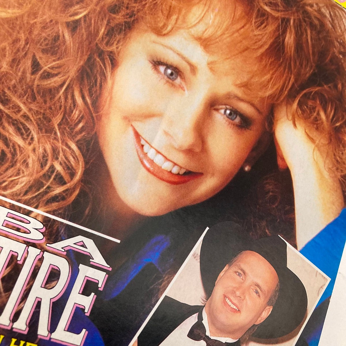 Close-up of Reba McEntire on the cover of Country Song Roundup Magazine, February 1992, alongside Garth Brooks, showcasing the vibrant country music scene of the early '90s.