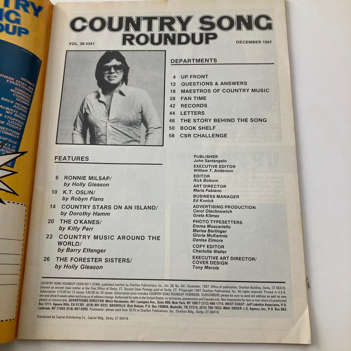 Cover of Country Song Roundup Magazine December 1987 featuring iconic artists Ronnie Milsap and K.T. Oslin, with department listings and features highlighted.