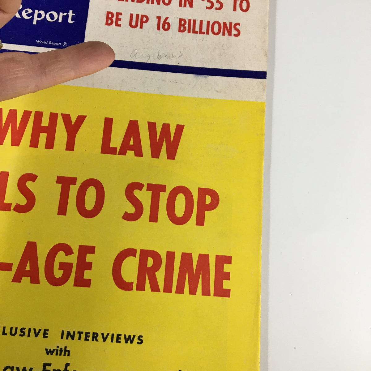 Close-up of the cover of US News & World Report Magazine from January 14, 1955, showcasing the bold headline 'Why Law Fails To Stop Teen-Age Crime' with a glimpse of the magazine's vintage condition.