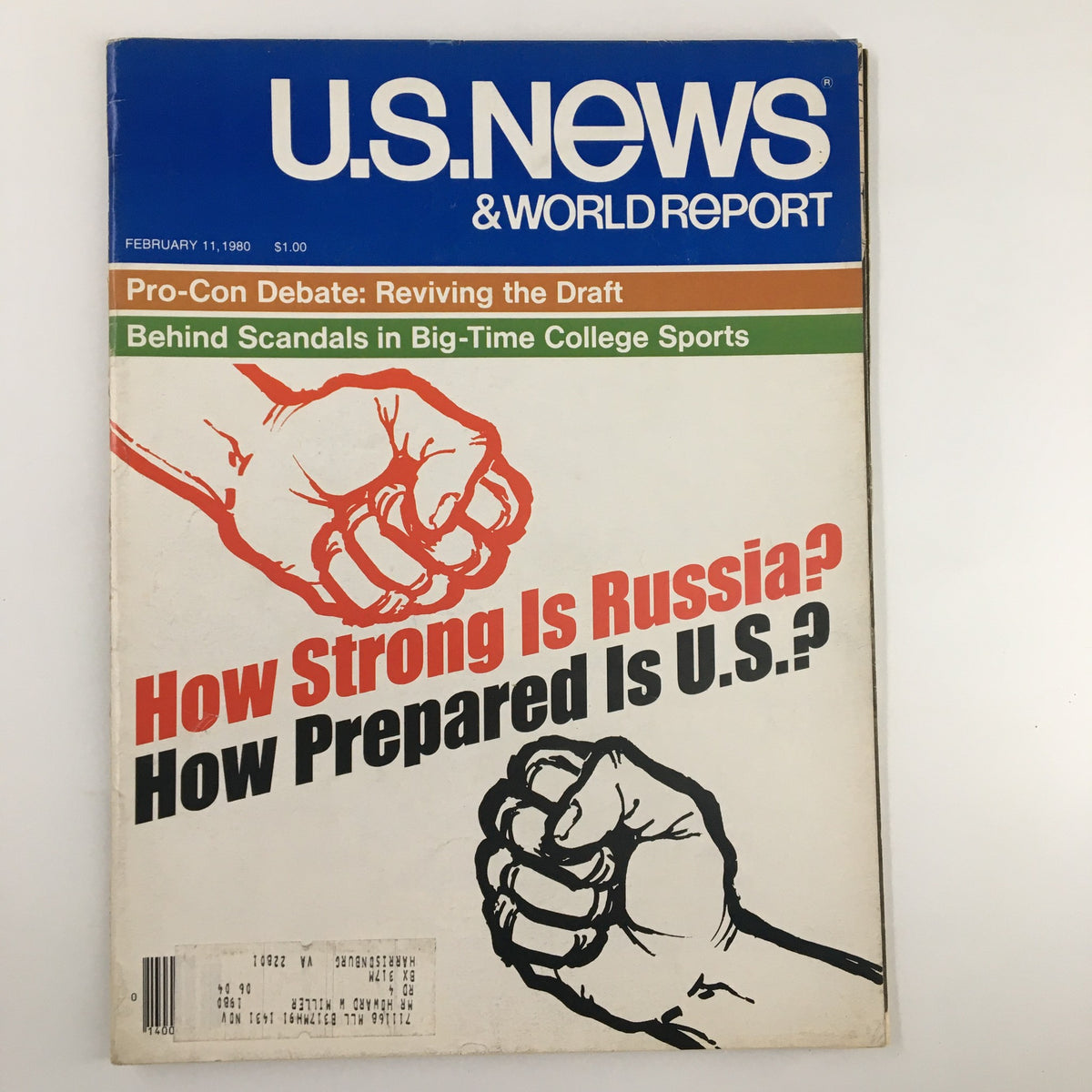 Cover of US News & World Report Magazine from February 11, 1980, featuring the Pro-Con Debate on Reviving the Draft. The cover depicts two clenched fists with bold text asking 'How Strong Is Russia? How Prepared Is U.S.?' highlighting a critical military and political discourse of the era.