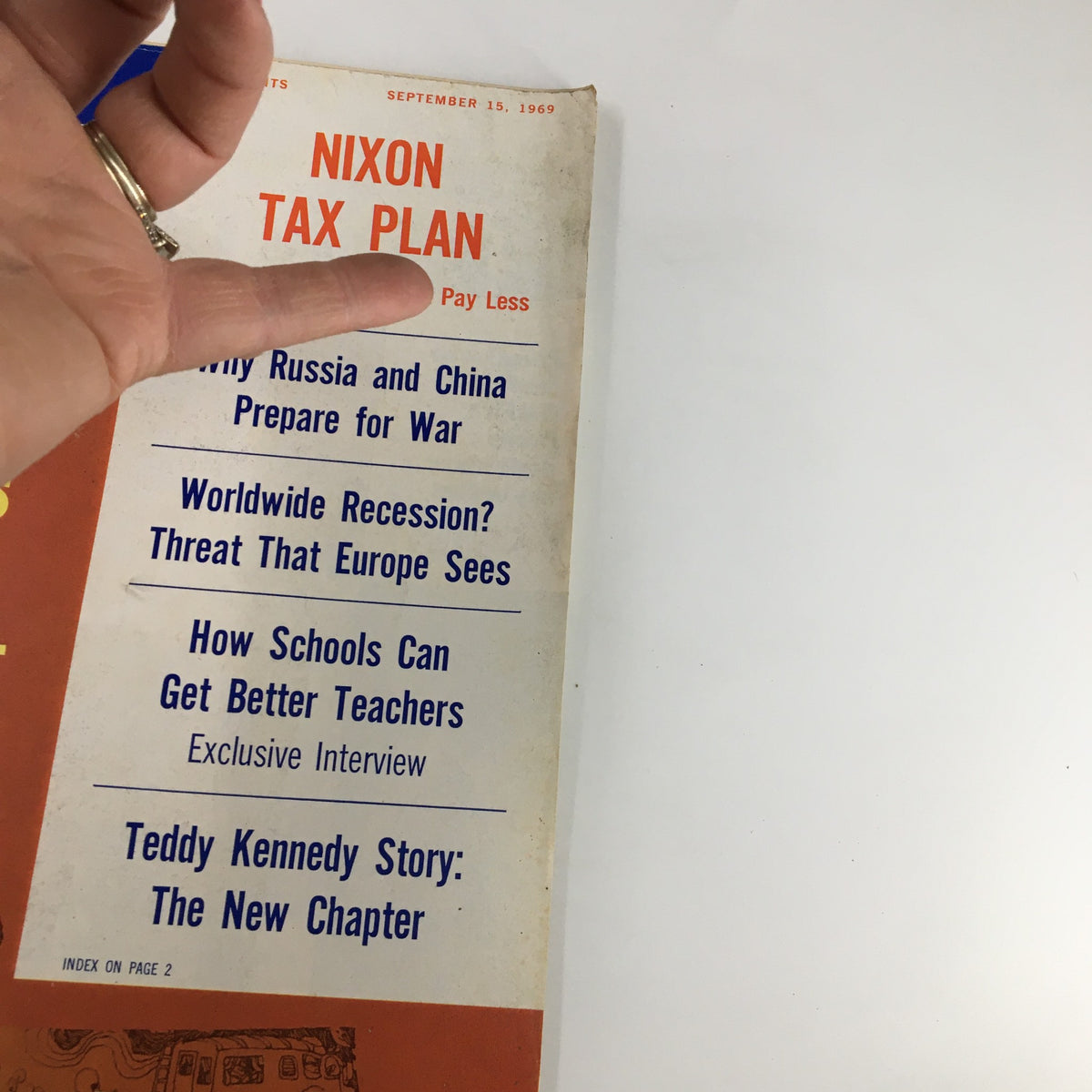 Close-up of the headline 'Nixon Tax Plan' from the September 15, 1969 issue of US News & World Report Magazine, highlighting key articles on global affairs and education.