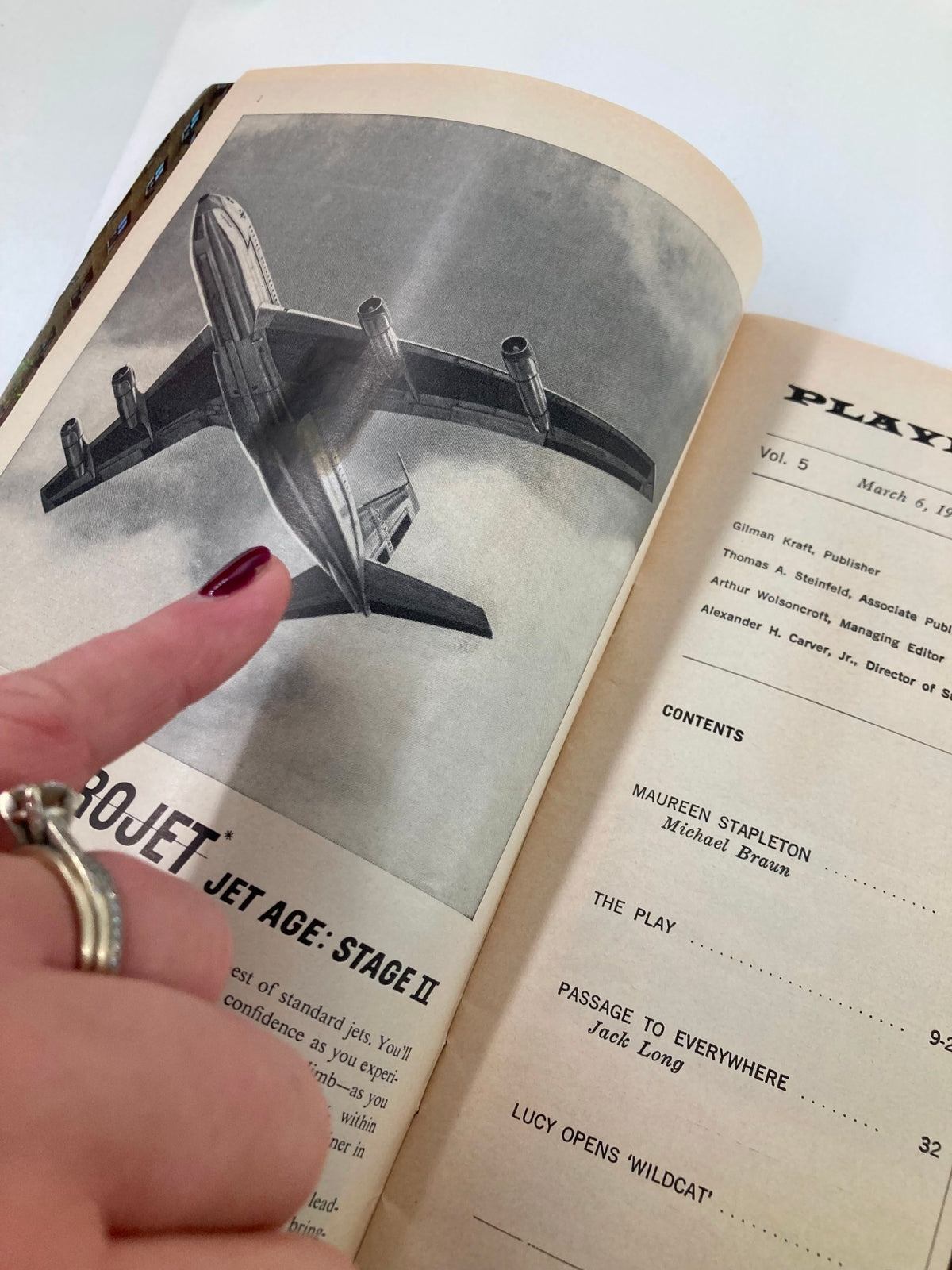 Inside view of a 1961 Playbill featuring a graphic of an airplane, related to the production 'Rhinoceros' at Longacre Theatre.