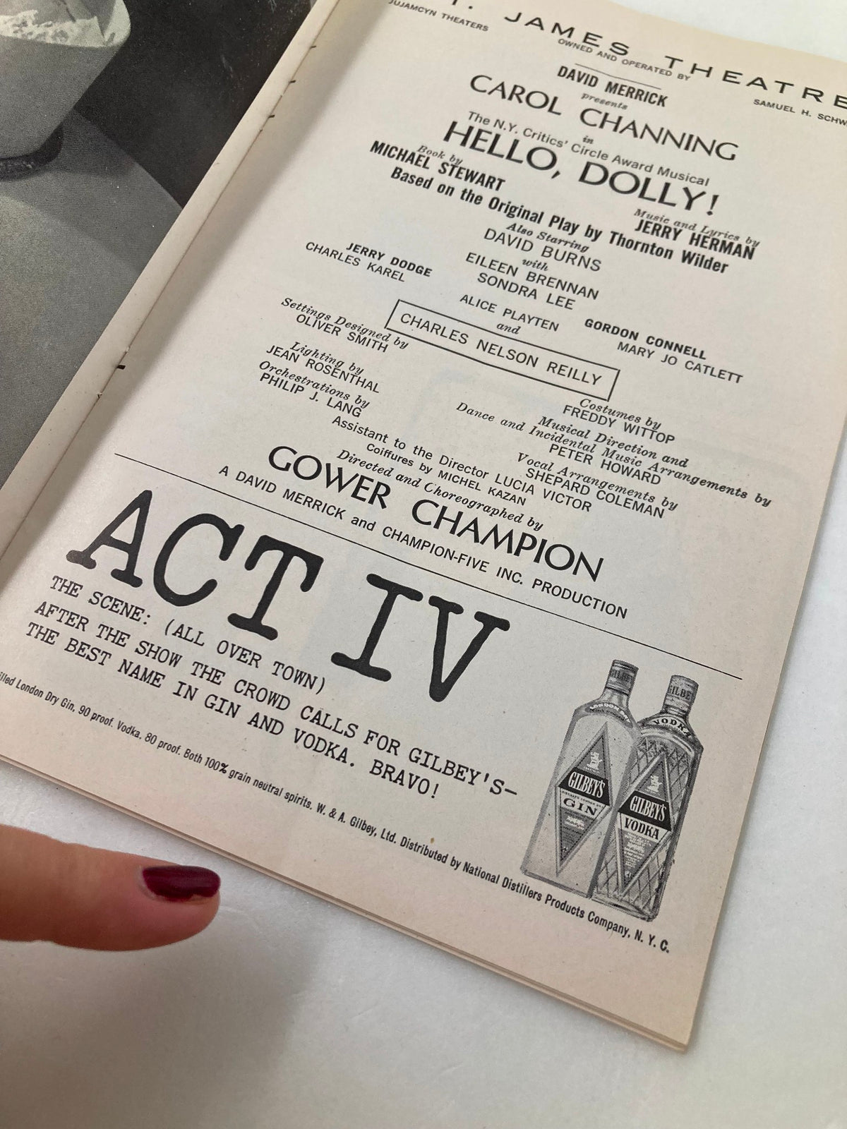 Close-up of the 1965 Playbill from St. James Theatre, highlighting the 'ACT IV' section for Hello, Dolly! with a focus on Gilbey's advertisement.
