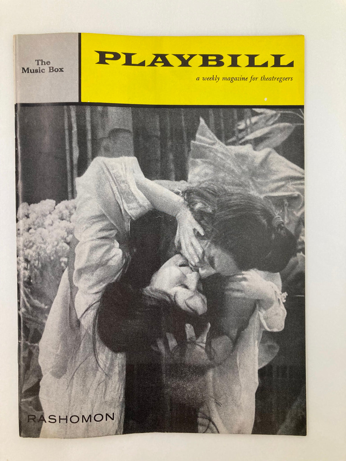 Vintage 1959 Playbill for The Music Box featuring the play Rashomon. The cover showcases a striking black and white image, capturing a dramatic moment, ideal for collectors and theatre enthusiasts.