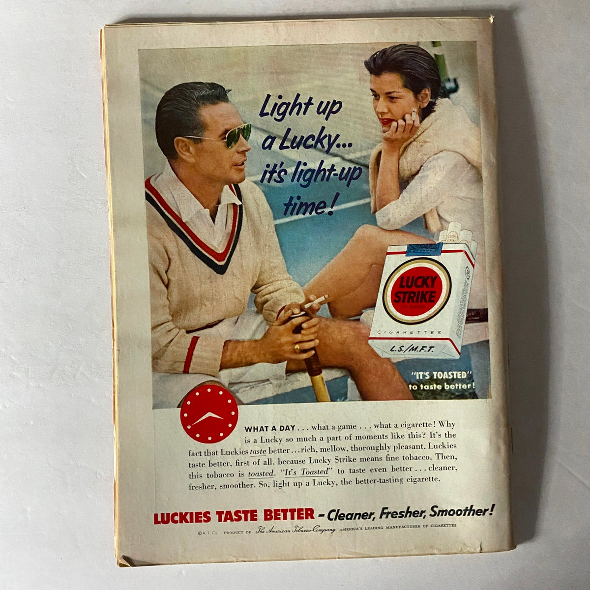 Back cover of Time Magazine May 2, 1955, featuring a vintage advertisement for Lucky Strike cigarettes, depicting a stylish couple enjoying leisure time.