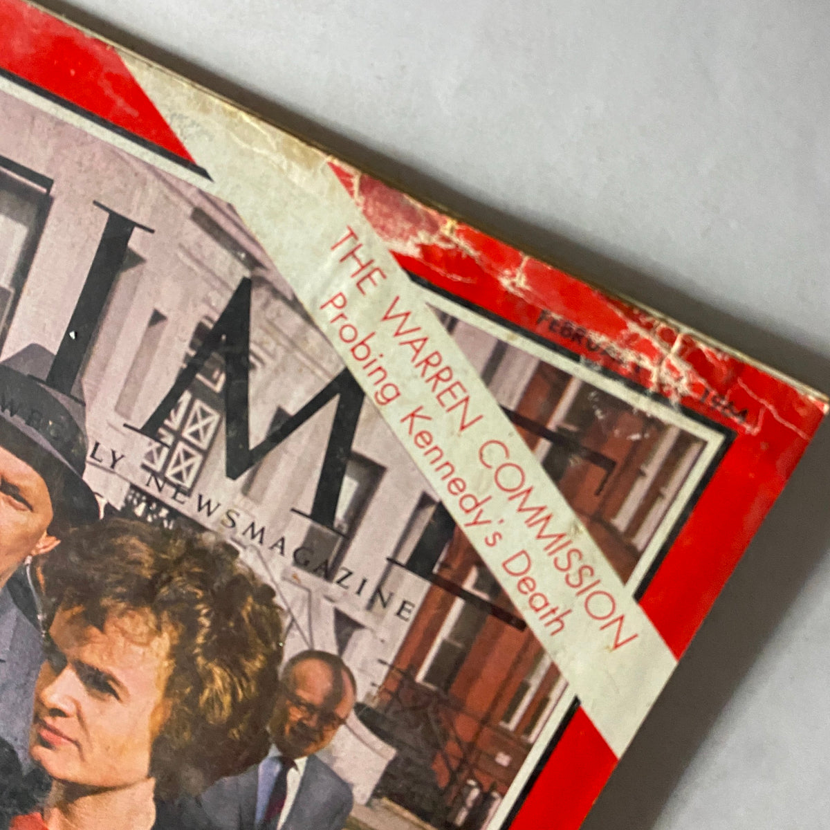 Close-up of the Time Magazine February 14, 1964 cover featuring Marina Oswald, highlighting the title and the tagline about the Warren Commission.