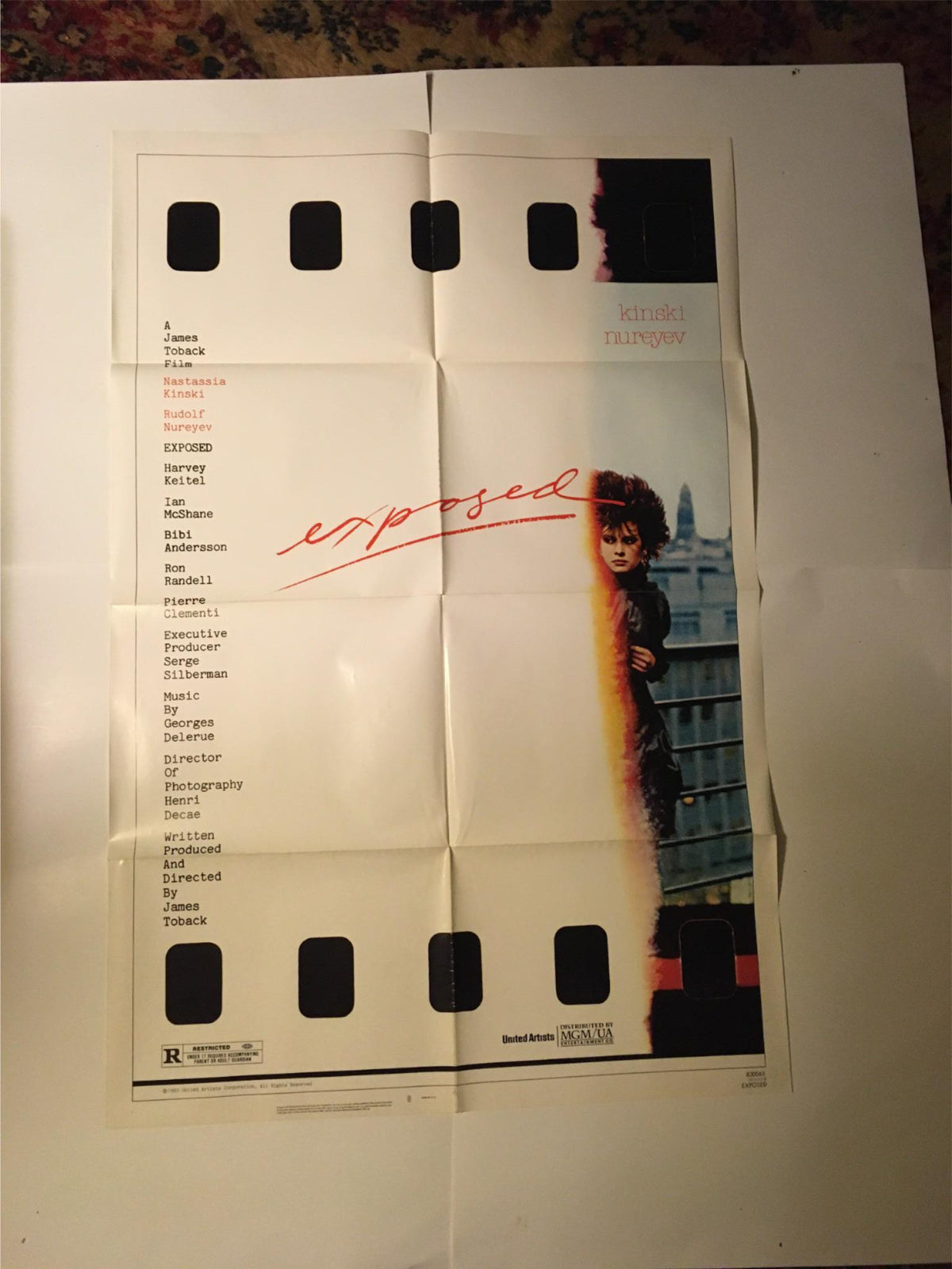 1983 Exposed 41" x 27" Original Movie Poster featuring Nastassia Kinski and Rudolf Nureyev. The poster showcases a prominent red title "exposed" and is printed on a folded design.