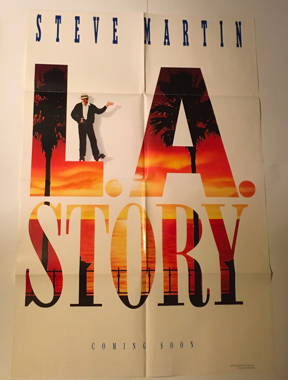 1990 L.A. Story 40" x 27" Original Movie Poster depicting Steve Martin with vibrant sunset colors surrounding the title, indicating the film's retro aesthetic.