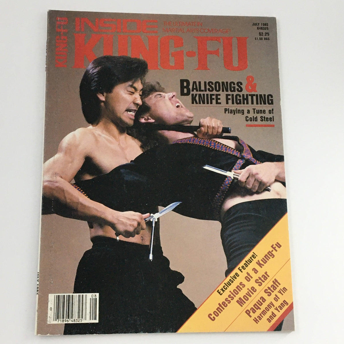 Inside Kung-Fu Magazine July 1985 cover illustrating balisongs and knife fighting, with a dynamic pose of two fighters engaged in a martial arts demonstration.