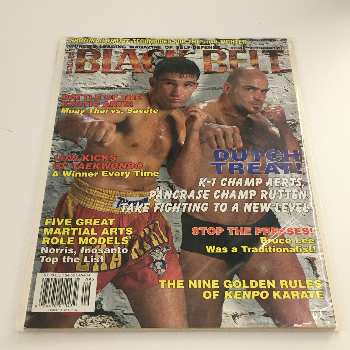 Cover of Black Belt Magazine September 1997 featuring Muay Thai vs Savate, showcasing fighters in action with vibrant headlines about martial arts techniques.