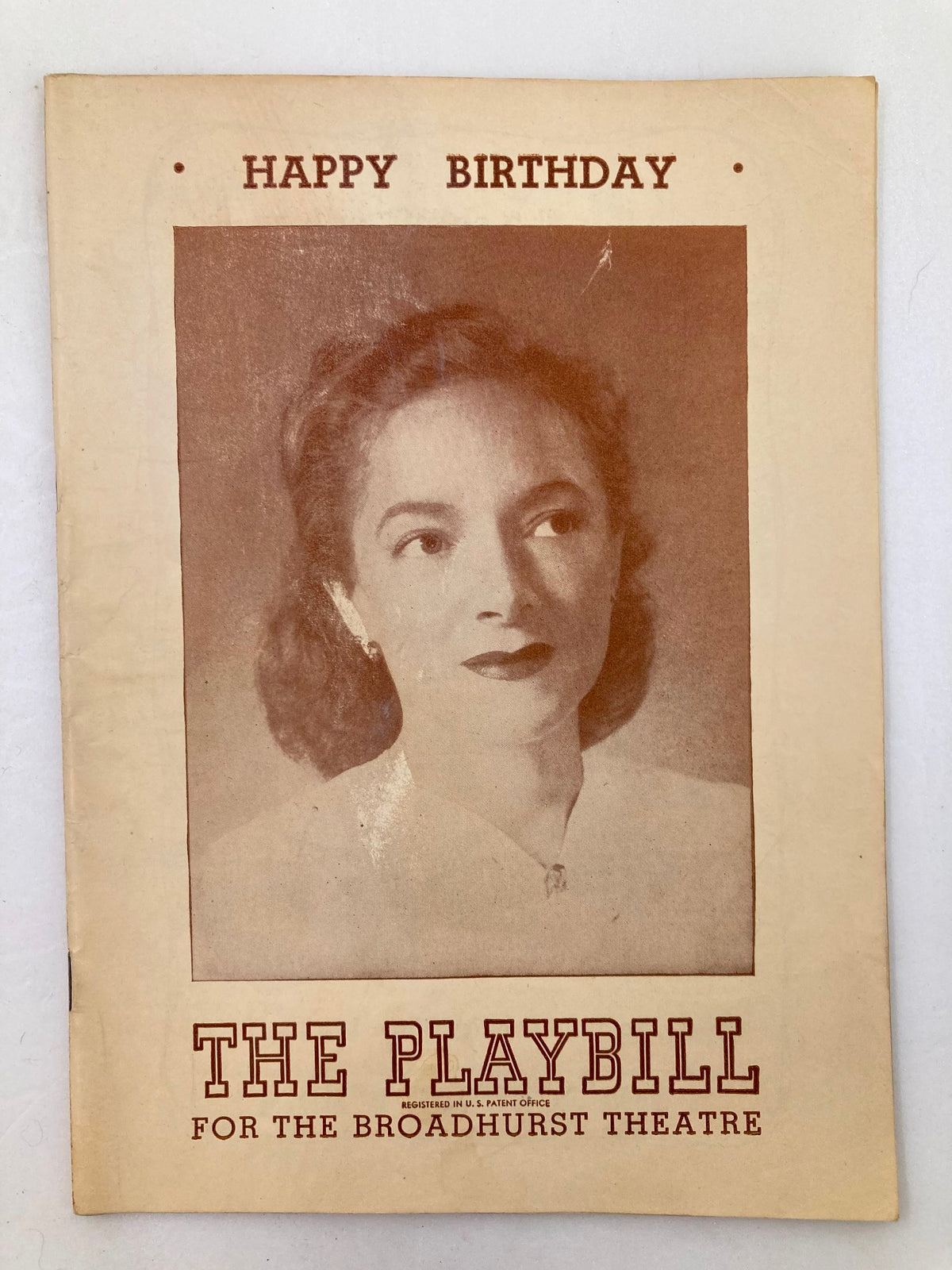 1947 Playbill titled 'Happy Birthday' featuring Helen Hayes at the Broadhurst Theatre, showcasing a vintage photograph of the actress on the cover.