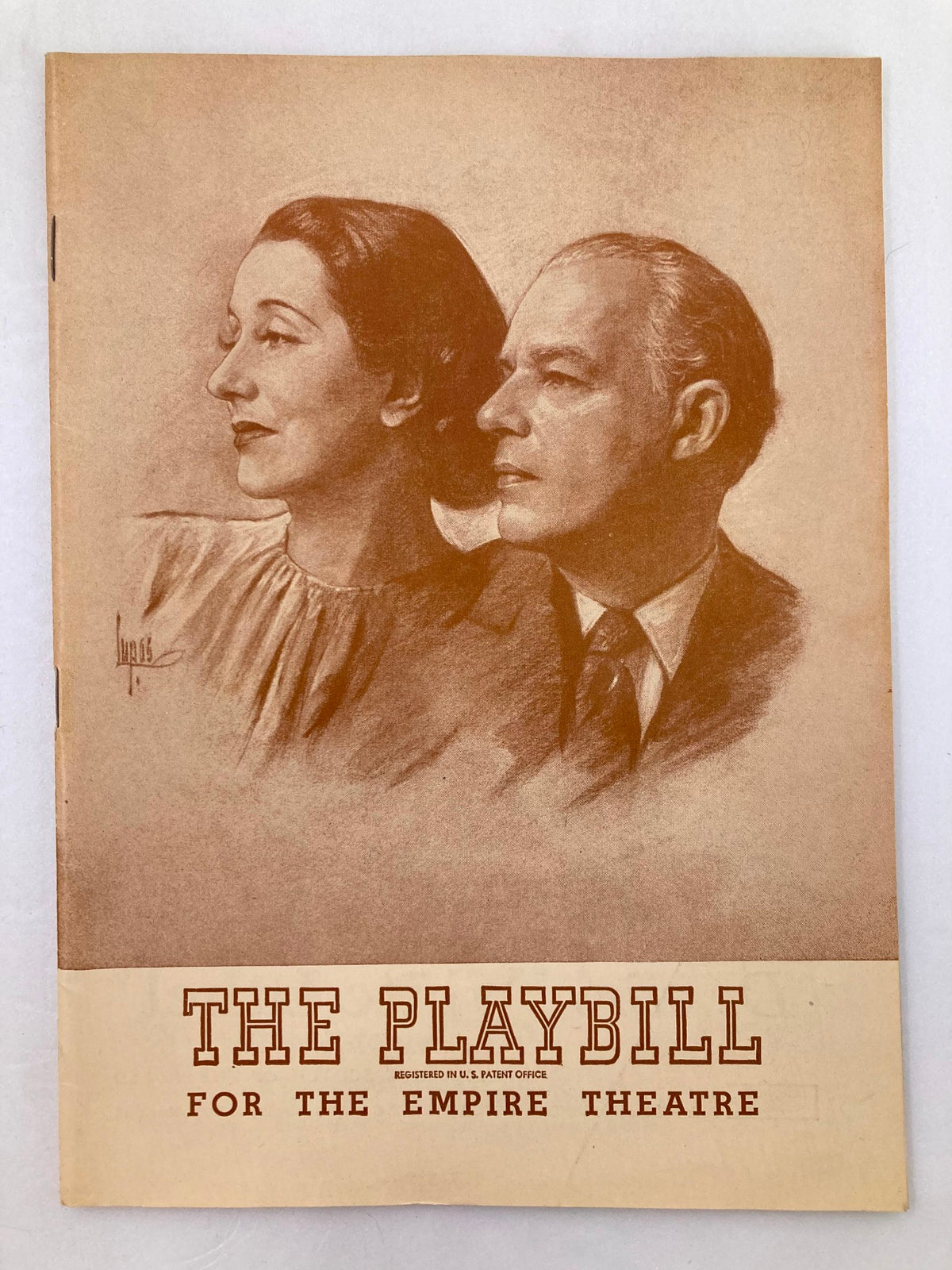 1946 Playbill The Empire Theatre featuring Alfred Lunt and Lynn Fontanne in O Mistress Mine, showcasing a vintage illustration of the two actors on the cover.