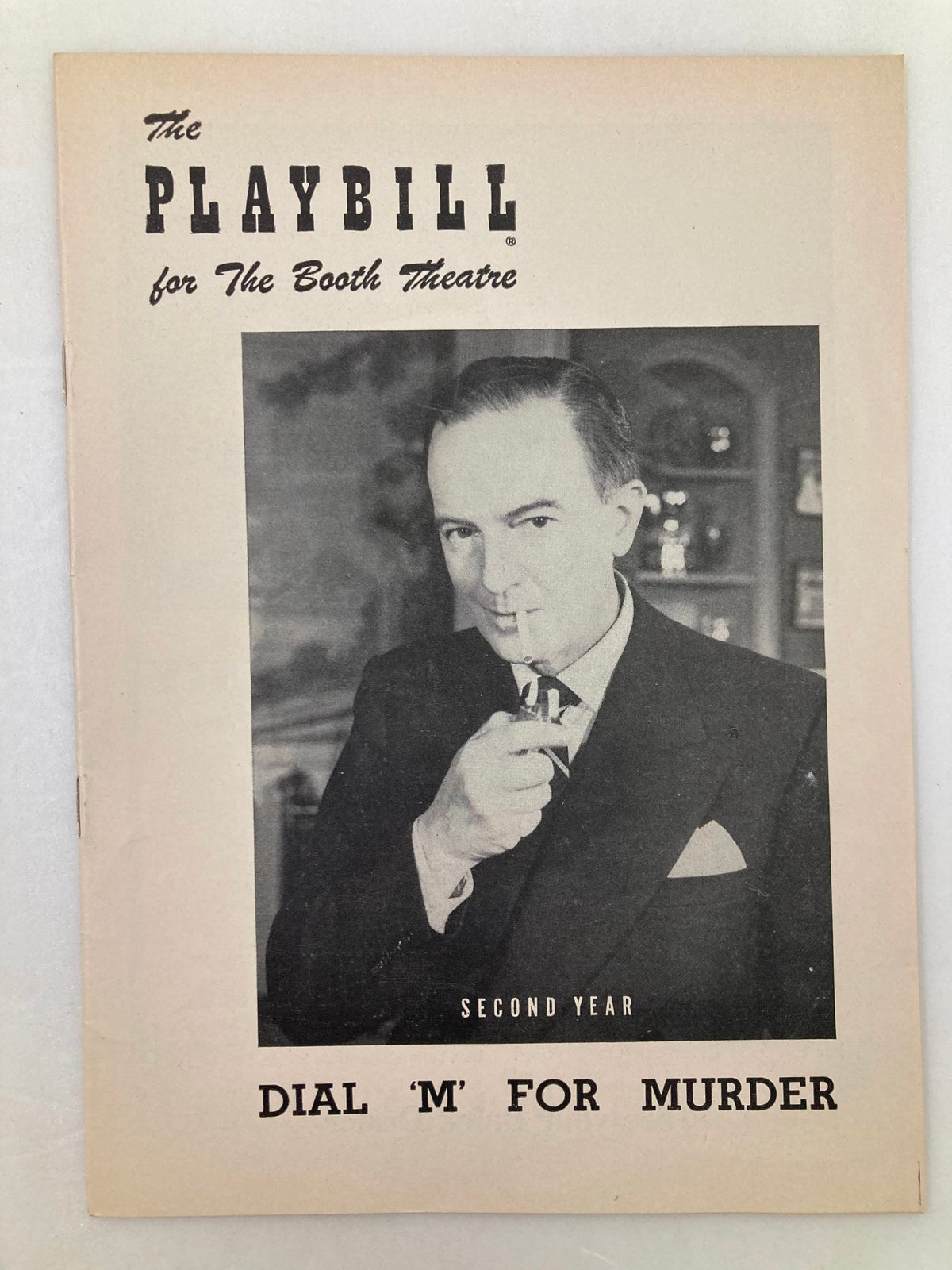 1954 Playbill for Dial 'M' For Murder featuring Maurice Evans at The Booth Theatre, showcasing a classic theatrical design with a portrait of Evans.