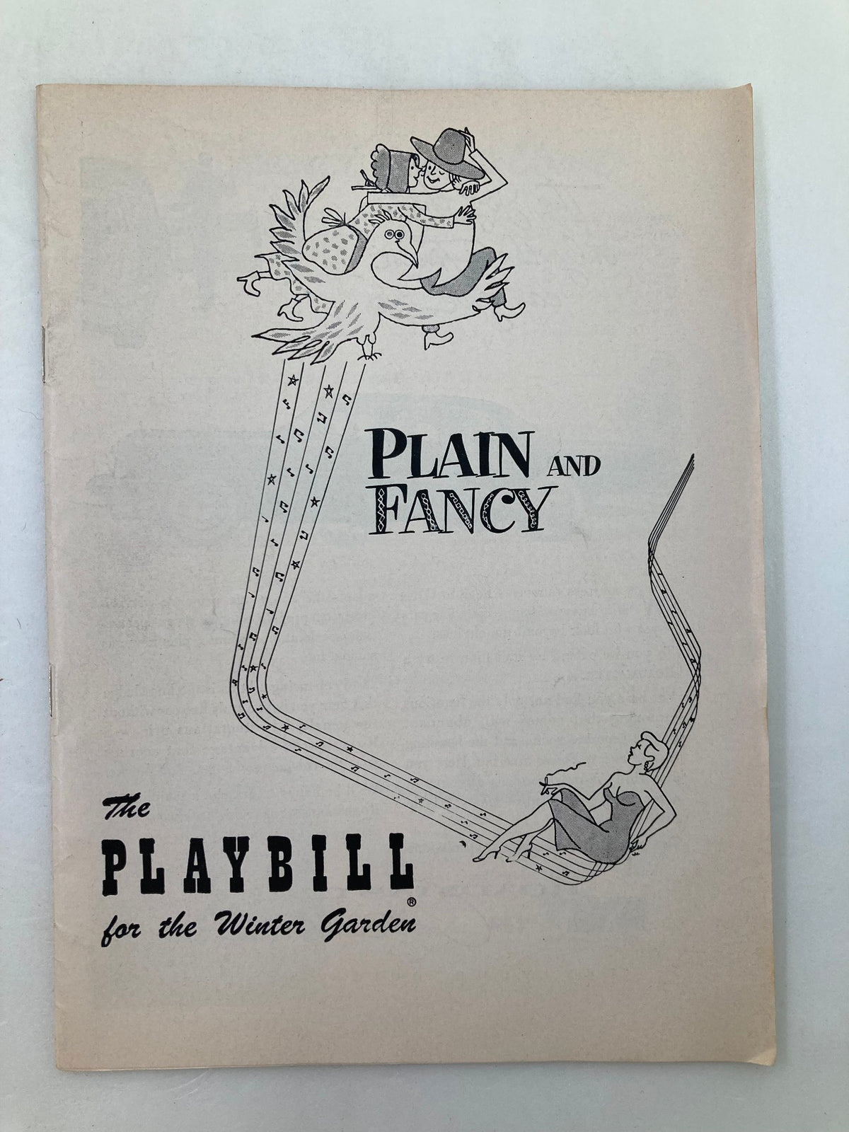 1955 Playbill for the musical Plain and Fancy featuring whimsical illustrations and the title prominently displayed, representing a piece of Broadway history.