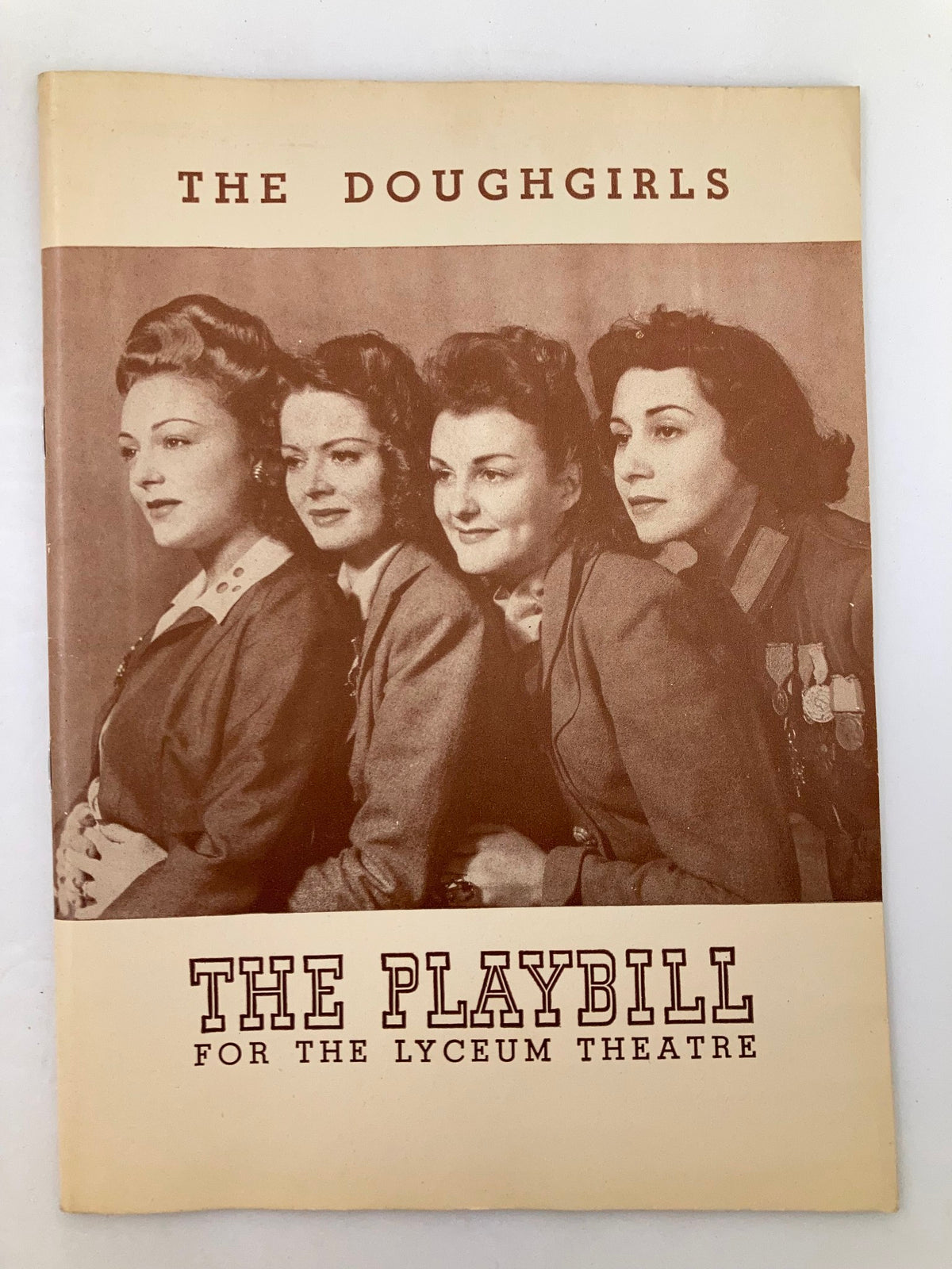 1943 Playbill for The Doughgirls, featuring a vintage cover image of four actresses in theatrical costumes at the Lyceum Theatre.