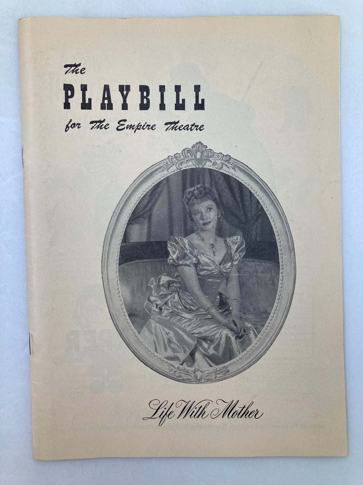 1949 Playbill for The Empire Theatre featuring Life with Mother, showcasing an elegant actress in a vintage gown.