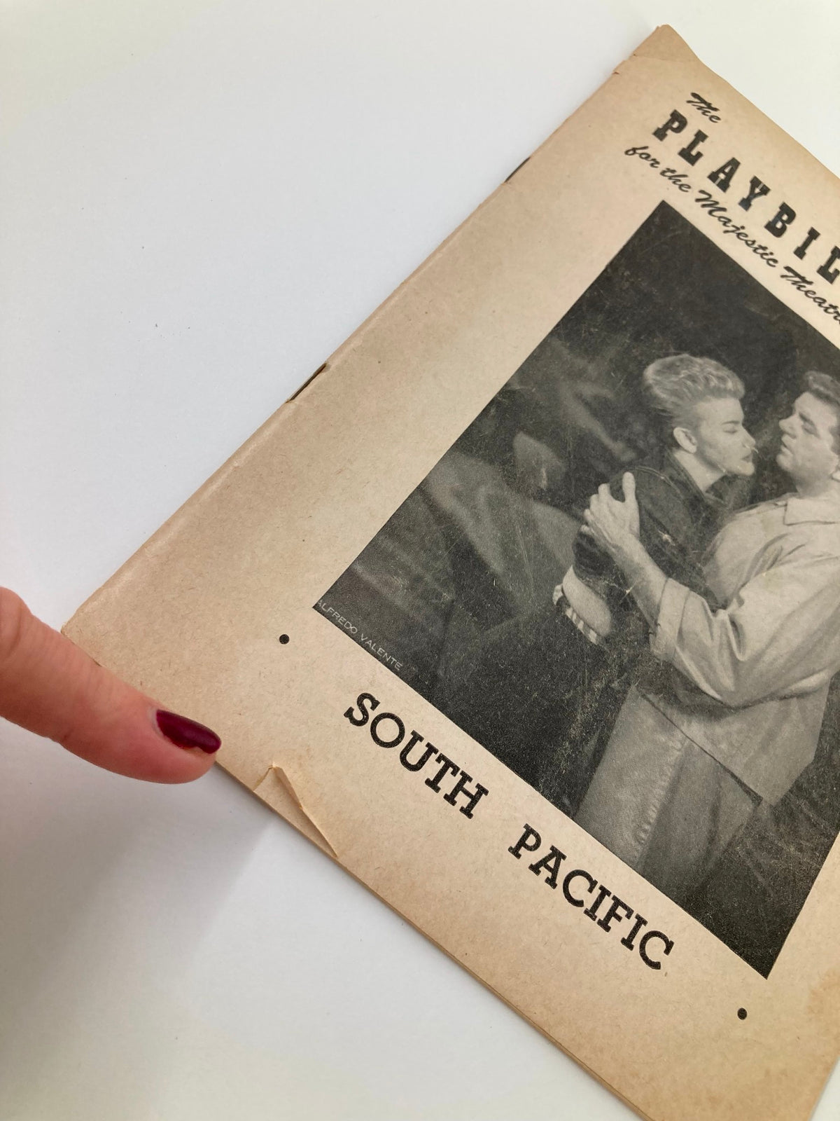 Close-up view of the 1953 Playbill for South Pacific at Majestic Theatre highlighting minor wear and vintage details.
