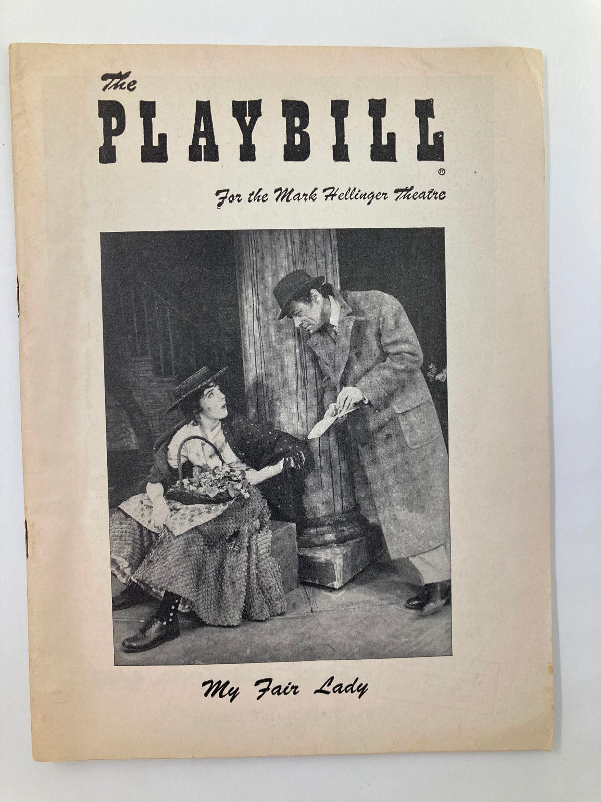 1956 Playbill for My Fair Lady at the Mark Hellinger Theatre featuring Rex Harrison and Julie Andrews. The cover displays a theatrical scene with characters in period costumes.