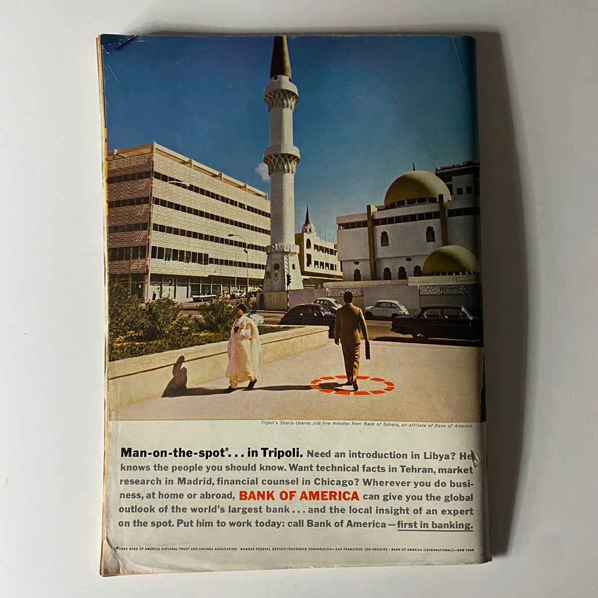 Back cover of Business Week magazine June 25, 1966, showcasing a scene in Tripoli with a focus on banking services, emphasizing global business connections.