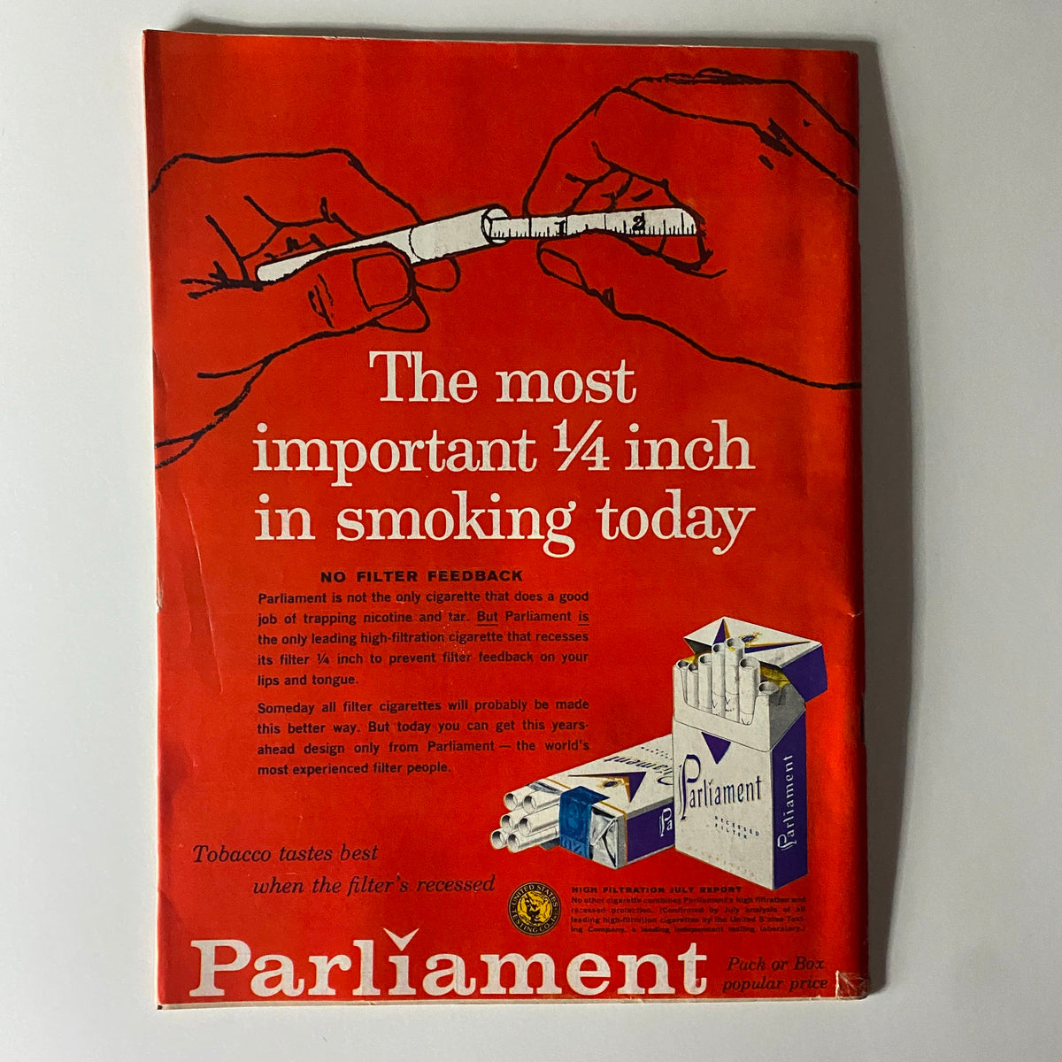 Vintage advertisement for Parliament cigarettes highlighting the 'most important ¼ inch in smoking today'. The ad artwork emphasizes the unique filter design, set against a bold red background.