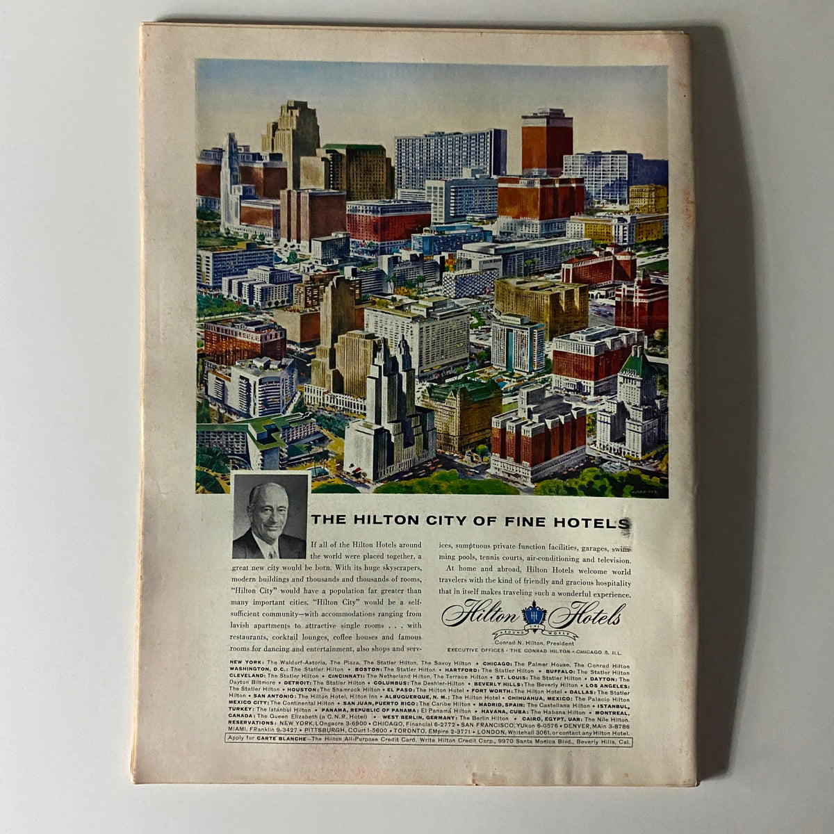 Back cover of Time Magazine April 20 1959 Vol 73 No. 16, displaying an advertisement for Hilton Hotels with an aerial view of a cityscape.