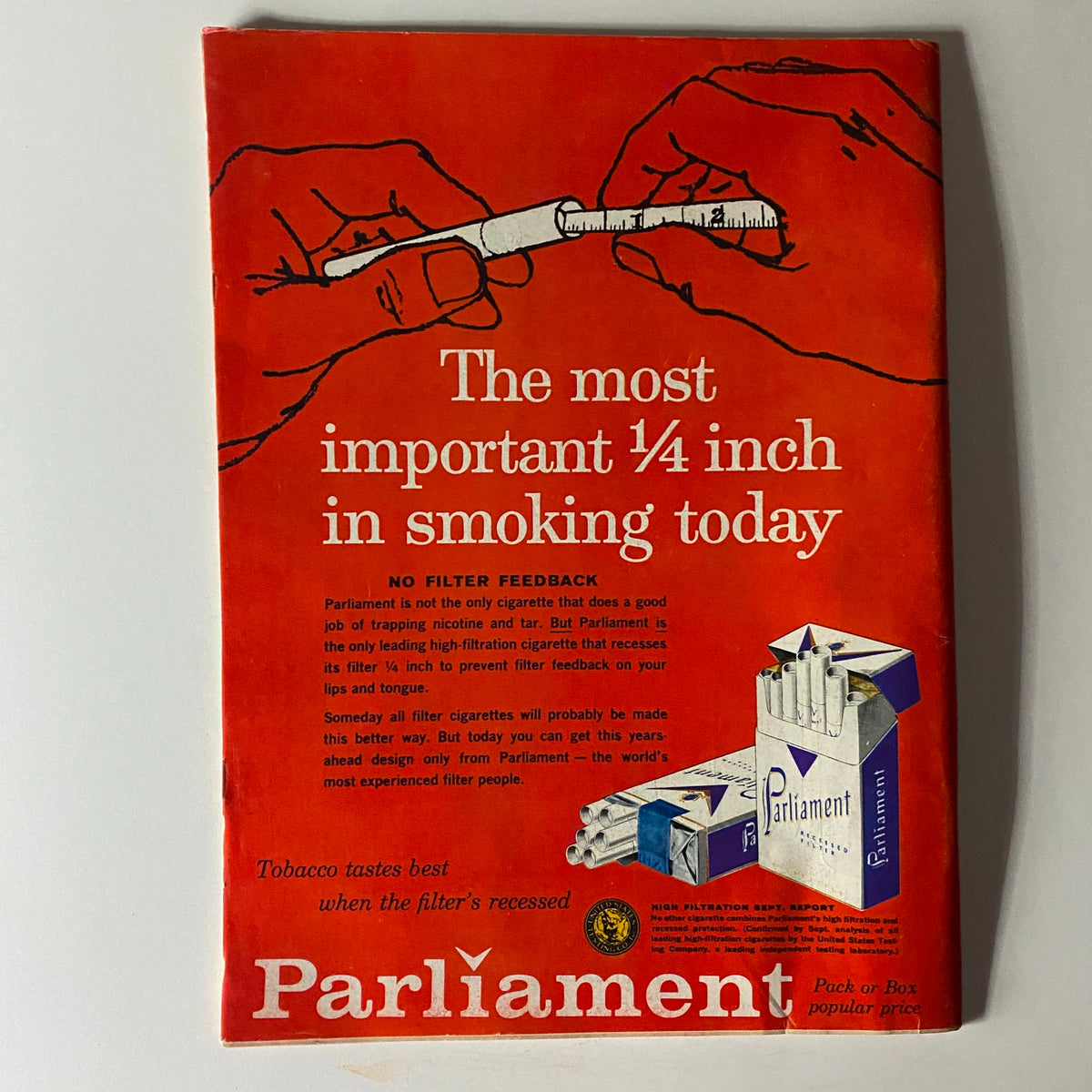 Vintage advertisement for Parliament cigarettes featuring a striking red background with a hand measuring a quarter-inch filter. The ad is titled 'The most important ¼ inch in smoking today,' highlighting the unique filter design and its purported benefits. This illustration is related to the Time Magazine September 28, 1959 issue featuring Nikita Khrushchev.